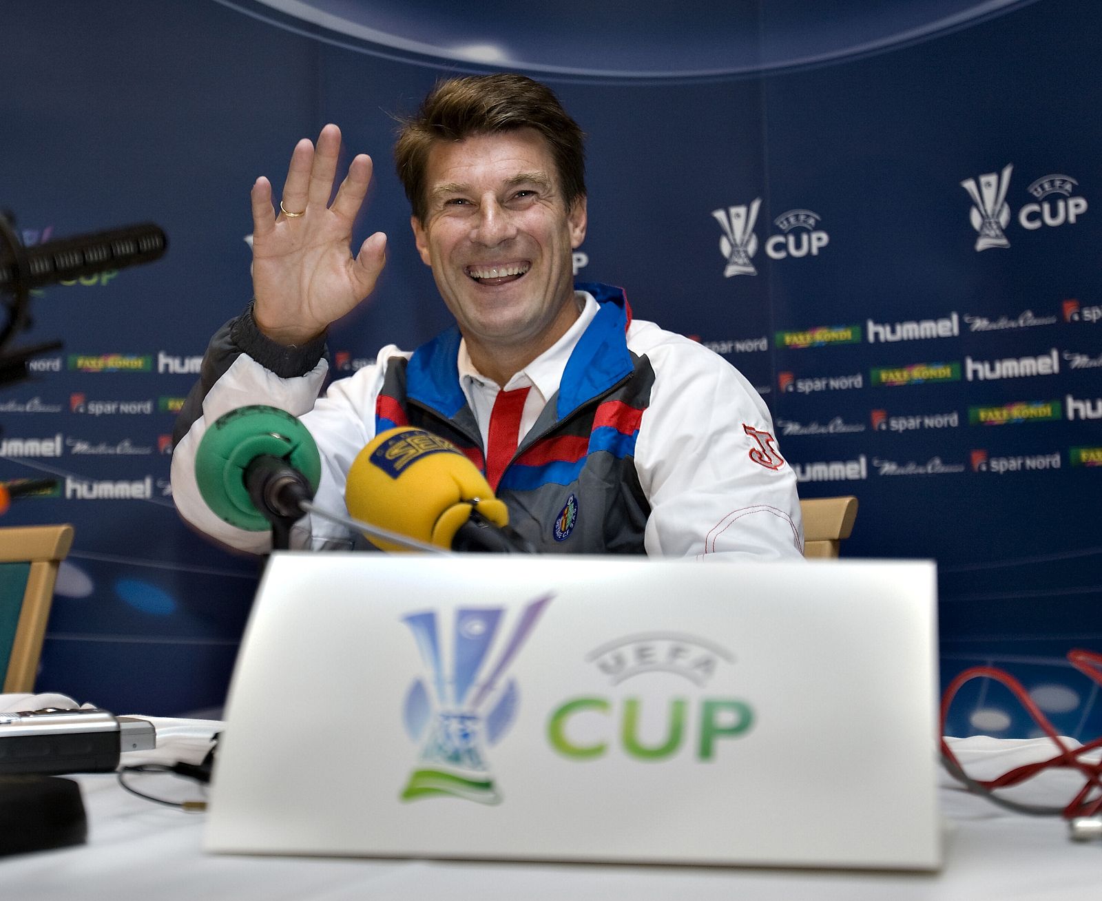 Michael Laudrup gestures during news conference in Aalborg