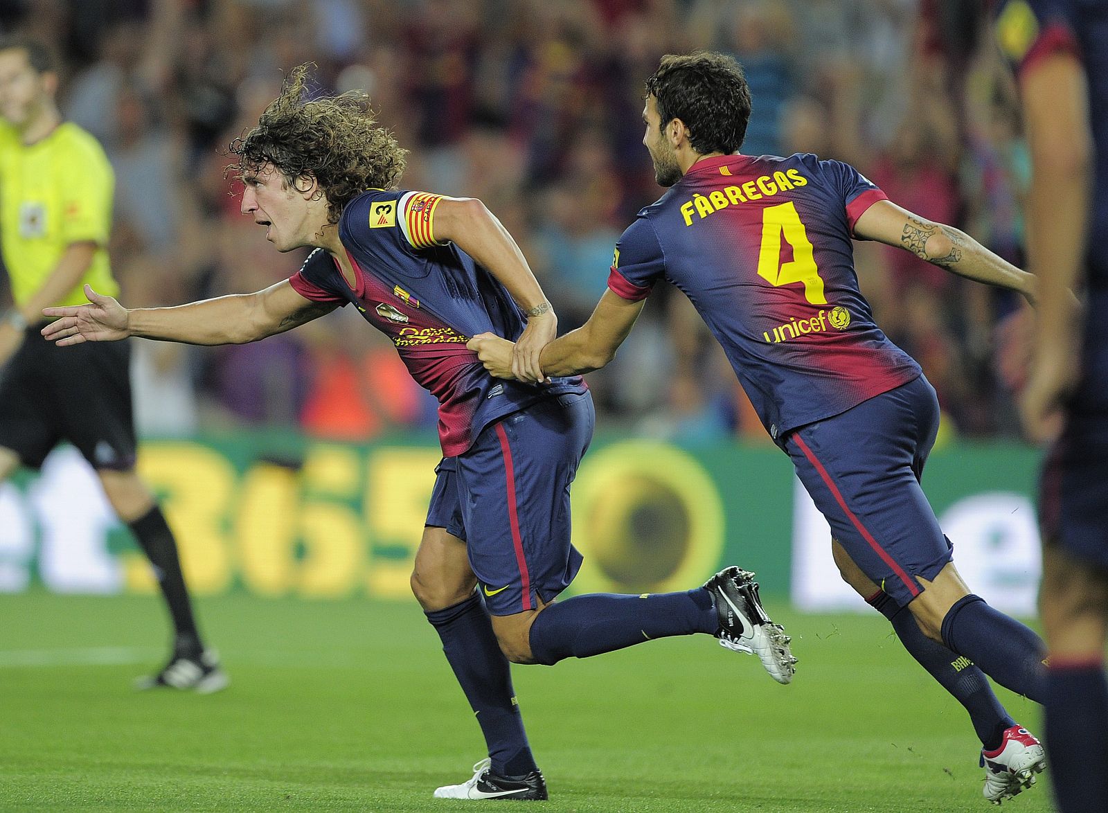 Los jugadores del Barça, Puyol y Fábregas, en la primera jornada de liga