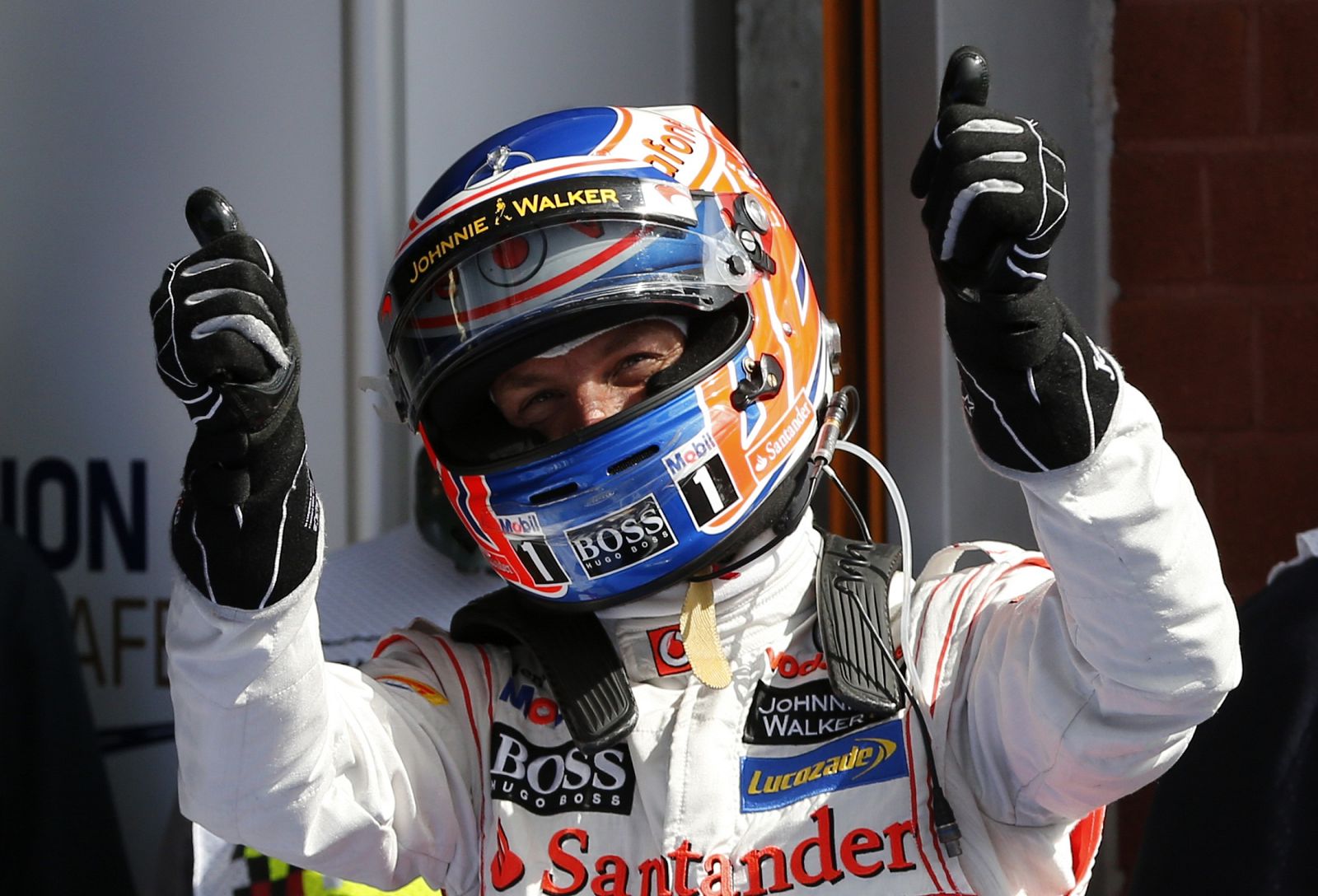 McLaren Formula One driver Button of Britain celebrates his pole position after the qualifying session of the Belgian F1 Grand Prix in Spa Francorchamps