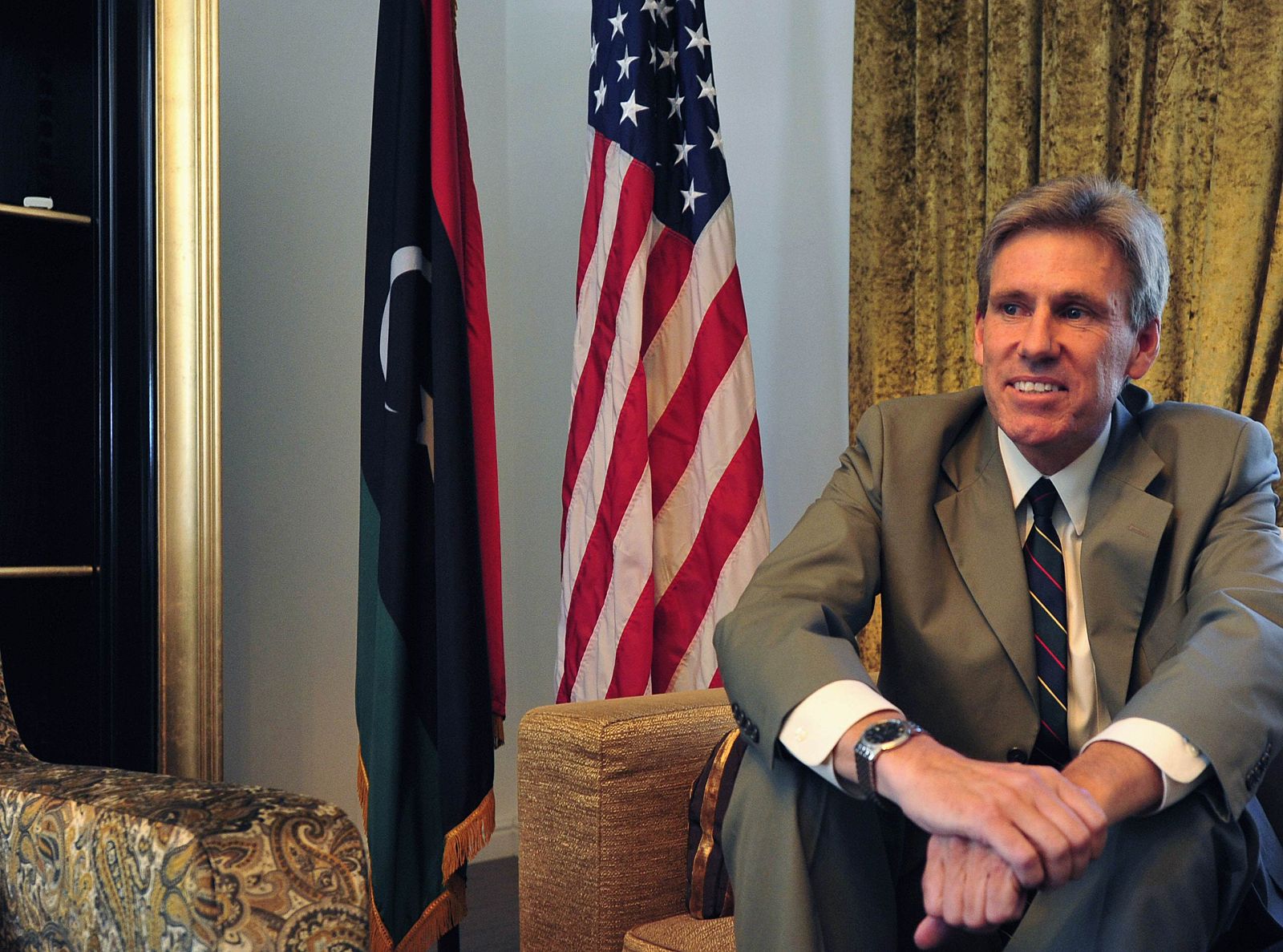 Christopher Stevens, the U.S. ambassador to Libya, smiles at his home in Tripoli