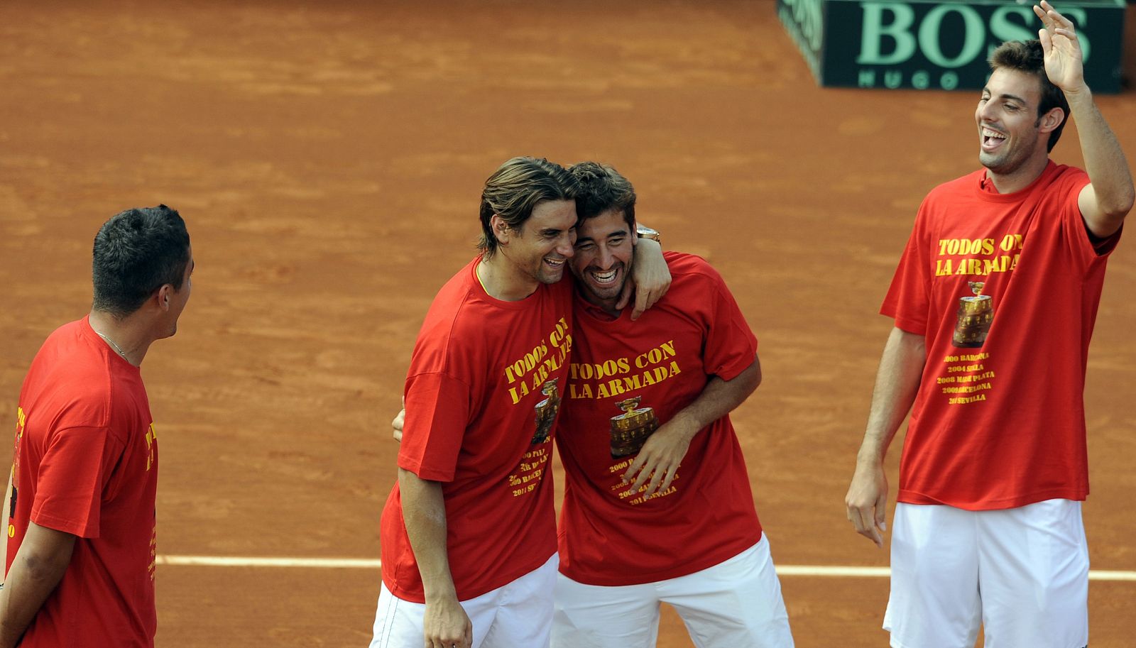 Almagro, Lopez and Granollers of Spain celebrate with compatriot Ferrer after he defeated Isner of the U.S. during the Davis Cup World Group semi-final fourth match in Gijon