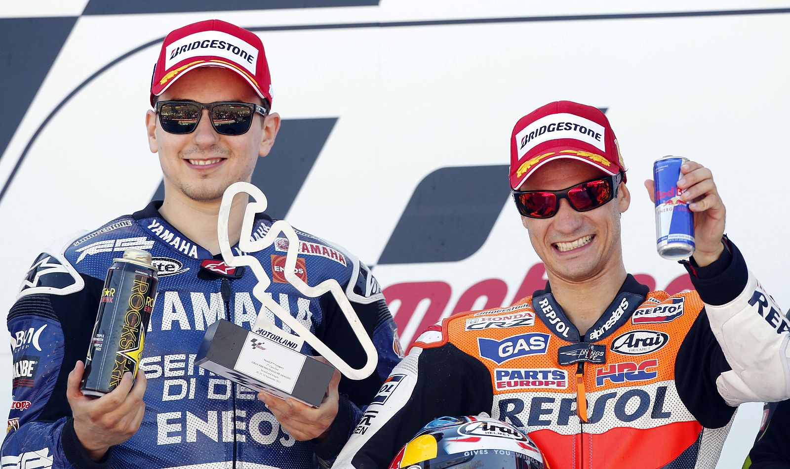 Honda MotoGP rider Pedrosa and Yamaha MotoGP rider Lorenzo celebrate after the Aragon MotoGP at the Motorland circuit in Alcaniz