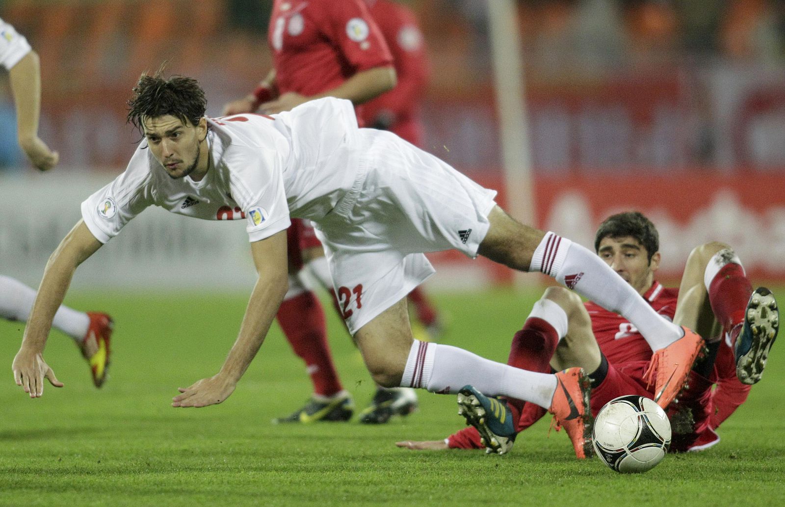 Georgia's David Devdariani challenges Belarus' Egor Filipenko during their 2014 World Cup qualifying soccer match in Minsk