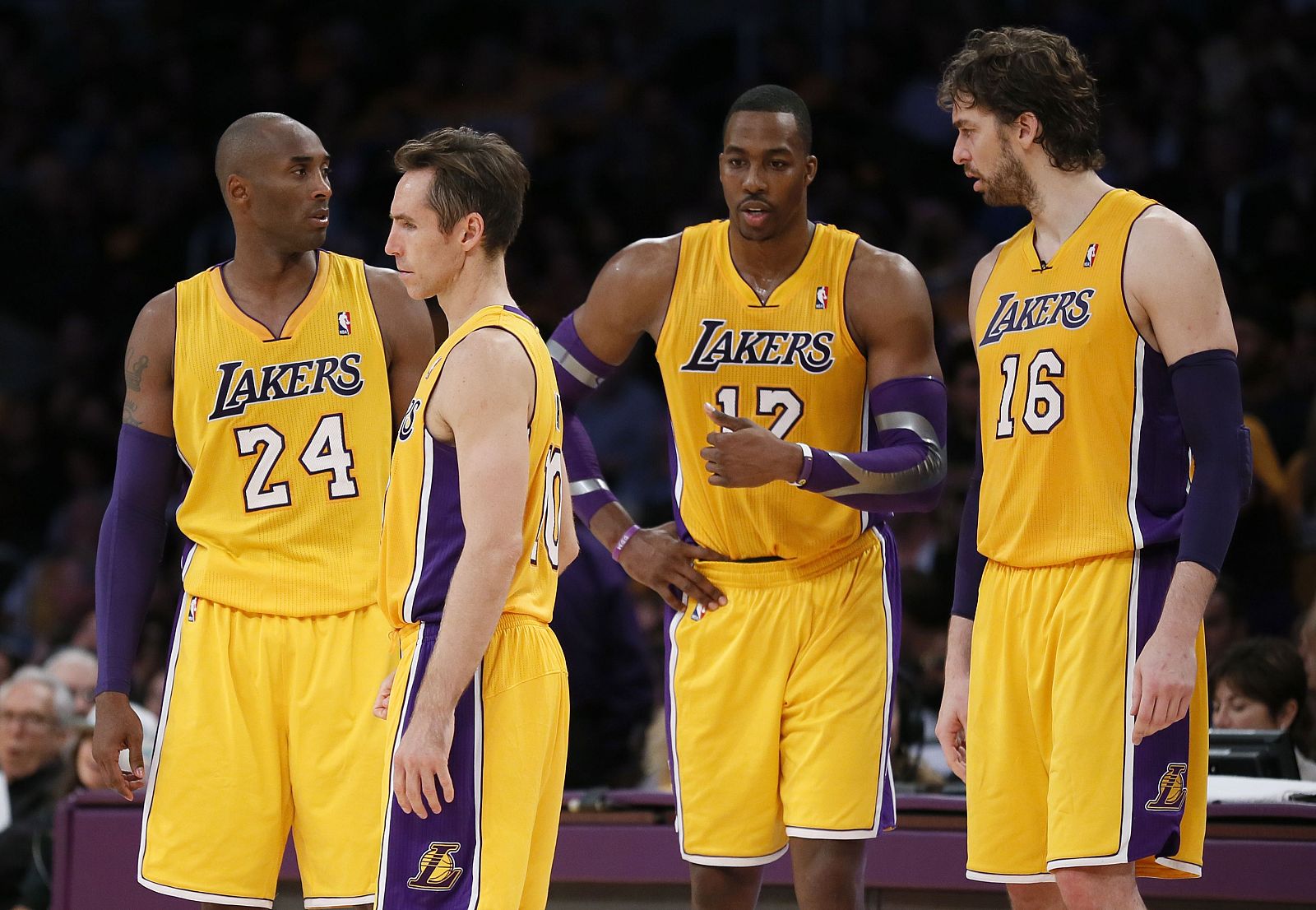 Lakers starters walk onto the court after a timeout during their loss to the Dallas Mavericks in their NBA basketball game in Los Angeles