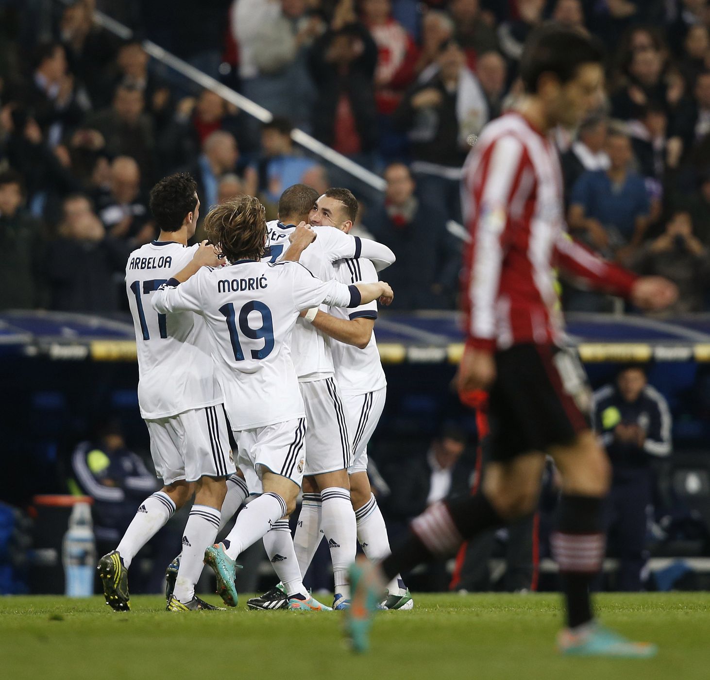 Real Madrid's Benzema is congratulated by teammates on goal against Athletic Bilbao during Spanish First Division soccer match in Madrid