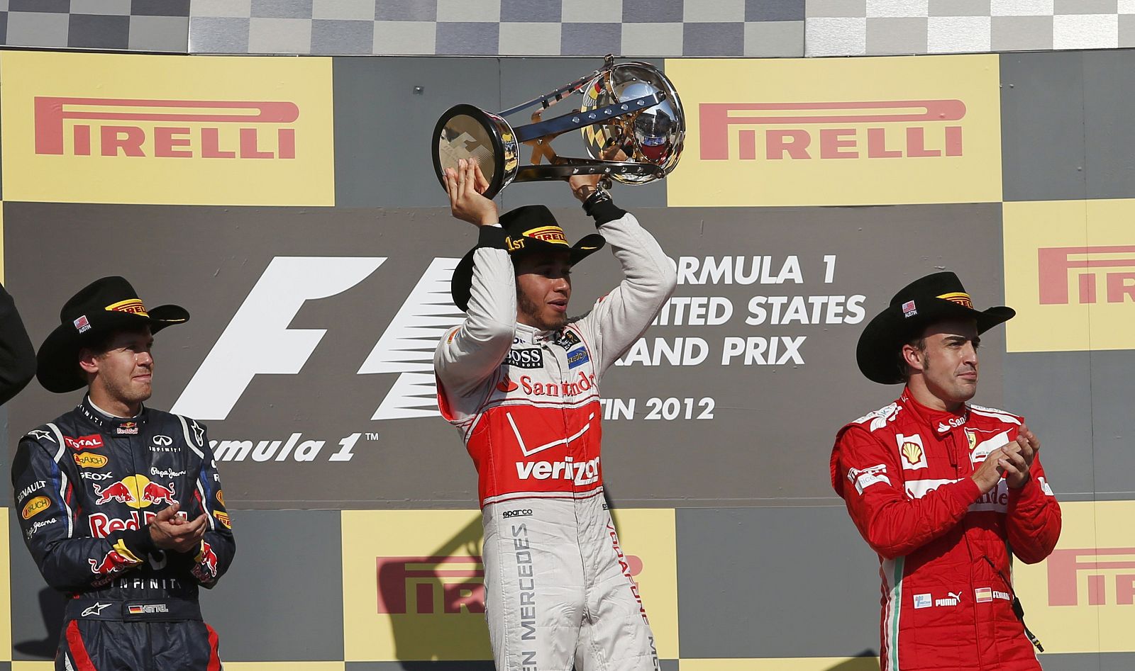 McLaren Formula One driver Hamilton holds up his trophy during the podium ceremony after the U.S. F1 Grand Prix in Austin