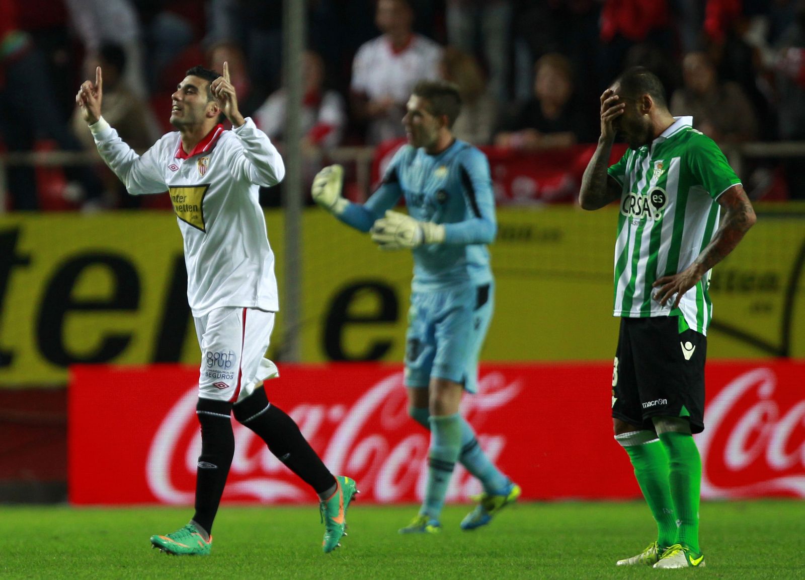 Sevilla's Jose Antonio Reyes celebrates after scoring against Real Betis during a soccer match in Seville