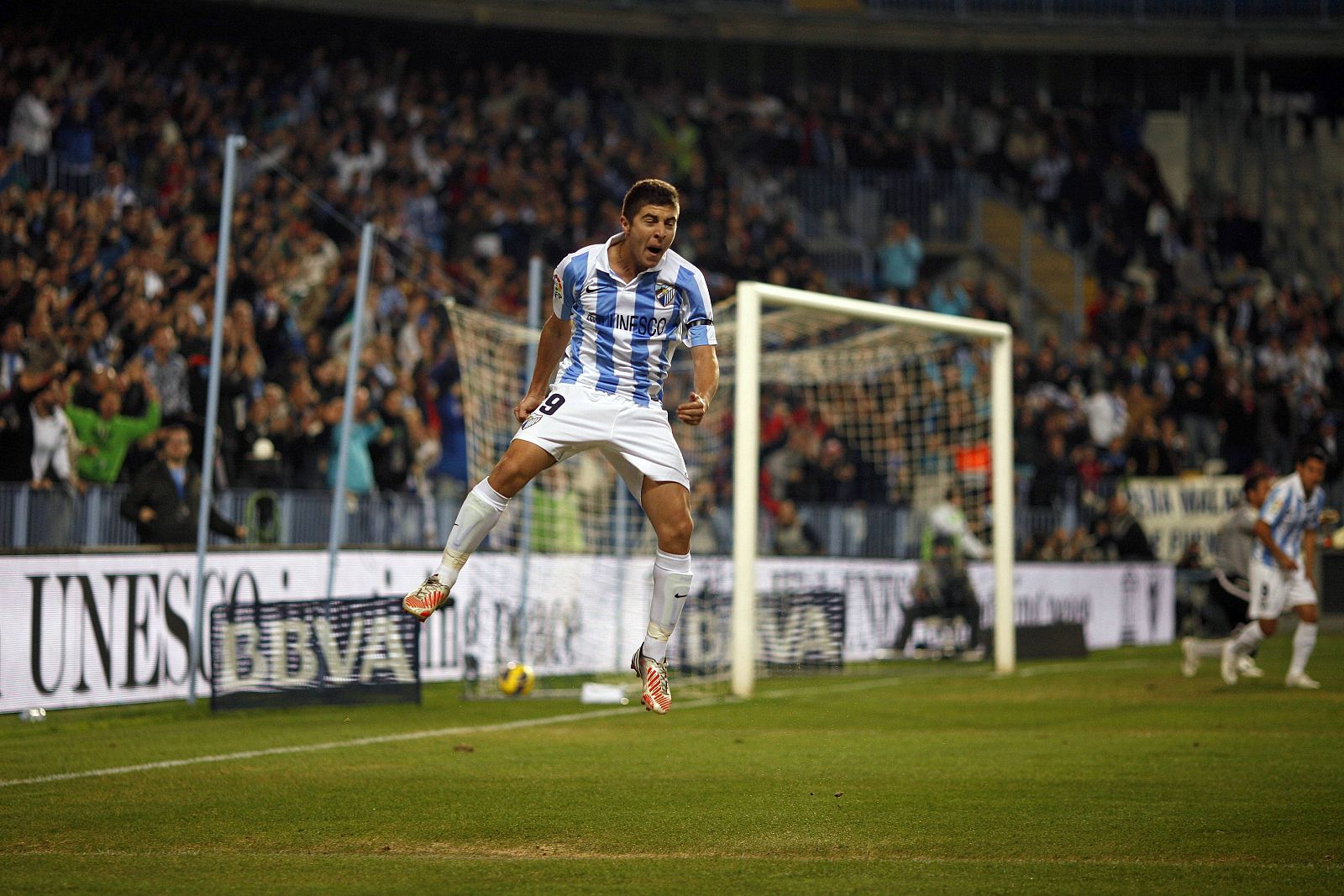 Malaga's Portillo celebrates after scoring a goal against Valencia during their Spanish First Division soccer match at La Rosaleda stadium in Malaga