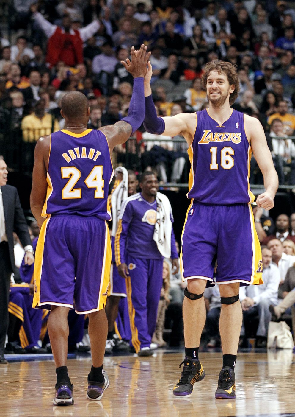 Los Angeles Lakers guard Kobe Bryant and forward Pau Gasol celebrate against the Dallas Mavericks during their NBA basketball game in Dallas, Texas