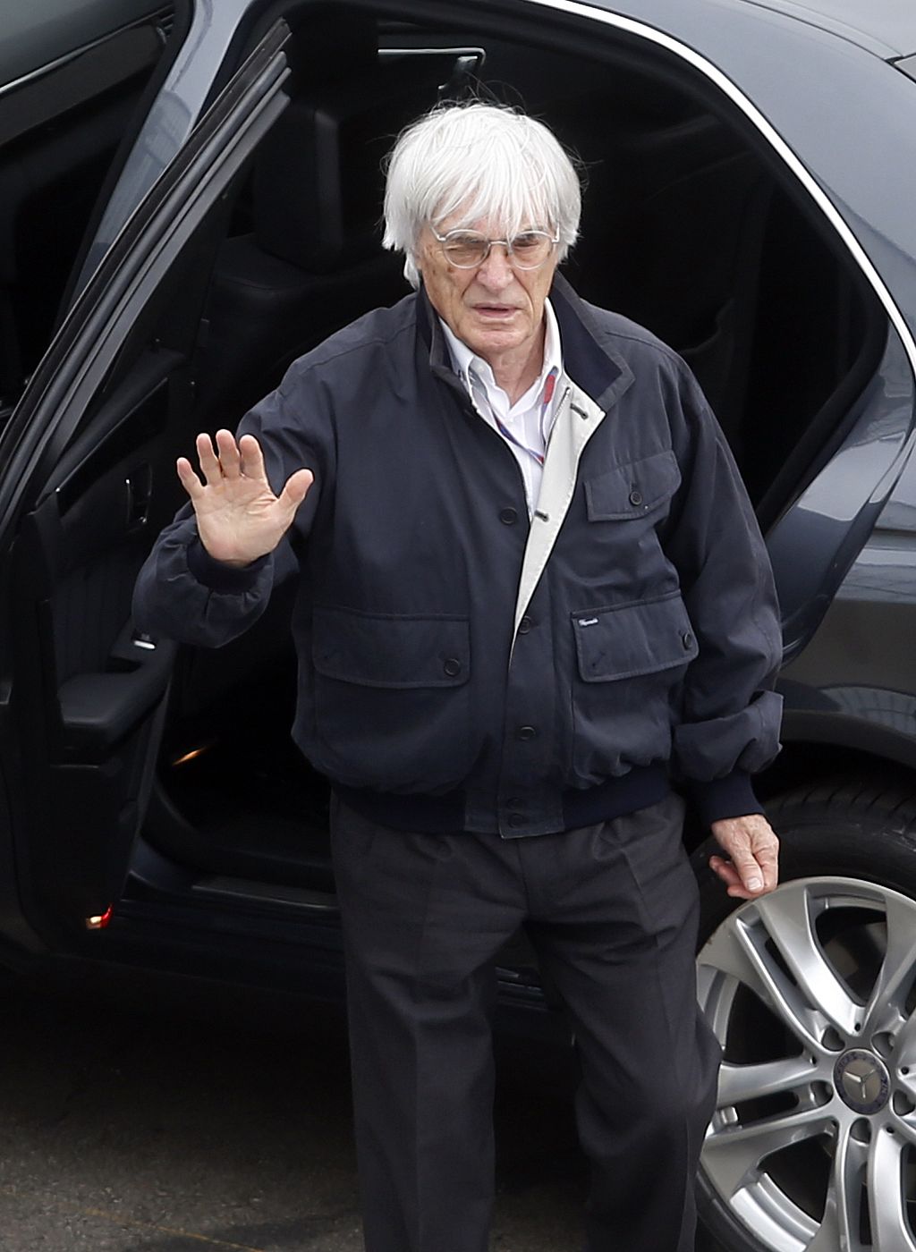 Formula One Grand Prix Chief Ecclestone of Britain waves as he arrives at Interlagos circuit for the Brazilian F1 Grand Prix in Sao Paulo
