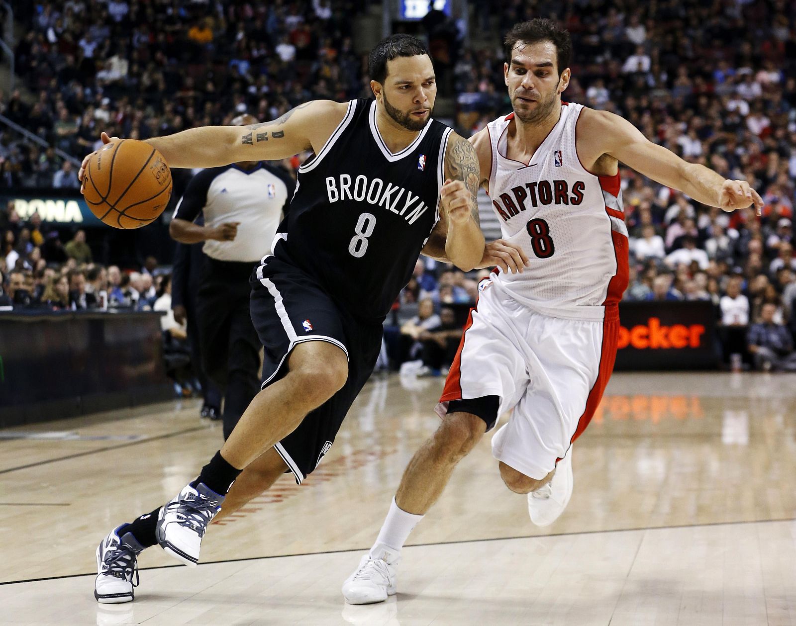 Nets Williams drives to the net past Raptors Calderon during their NBA basketball game in Toronto