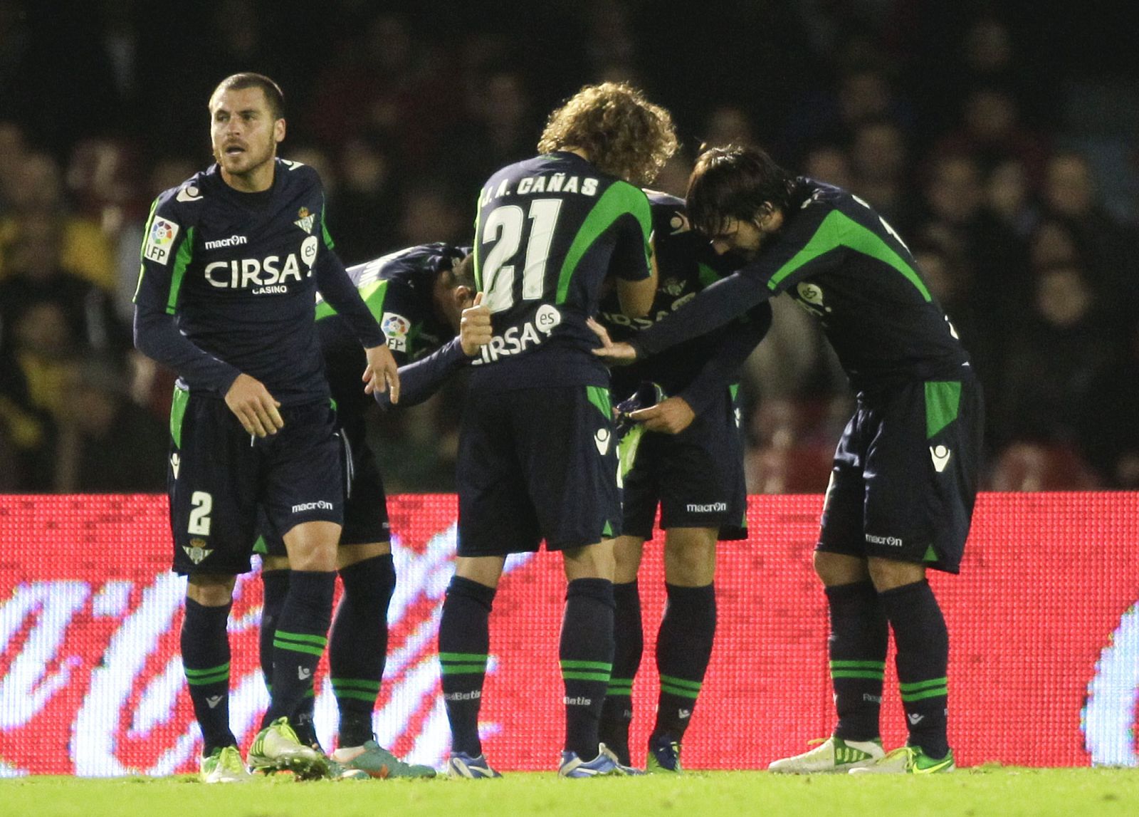 Real Betis players celebrate their goal against Celta Vigo during their Spanish first division soccer match at Balaidos stadium in Vigo