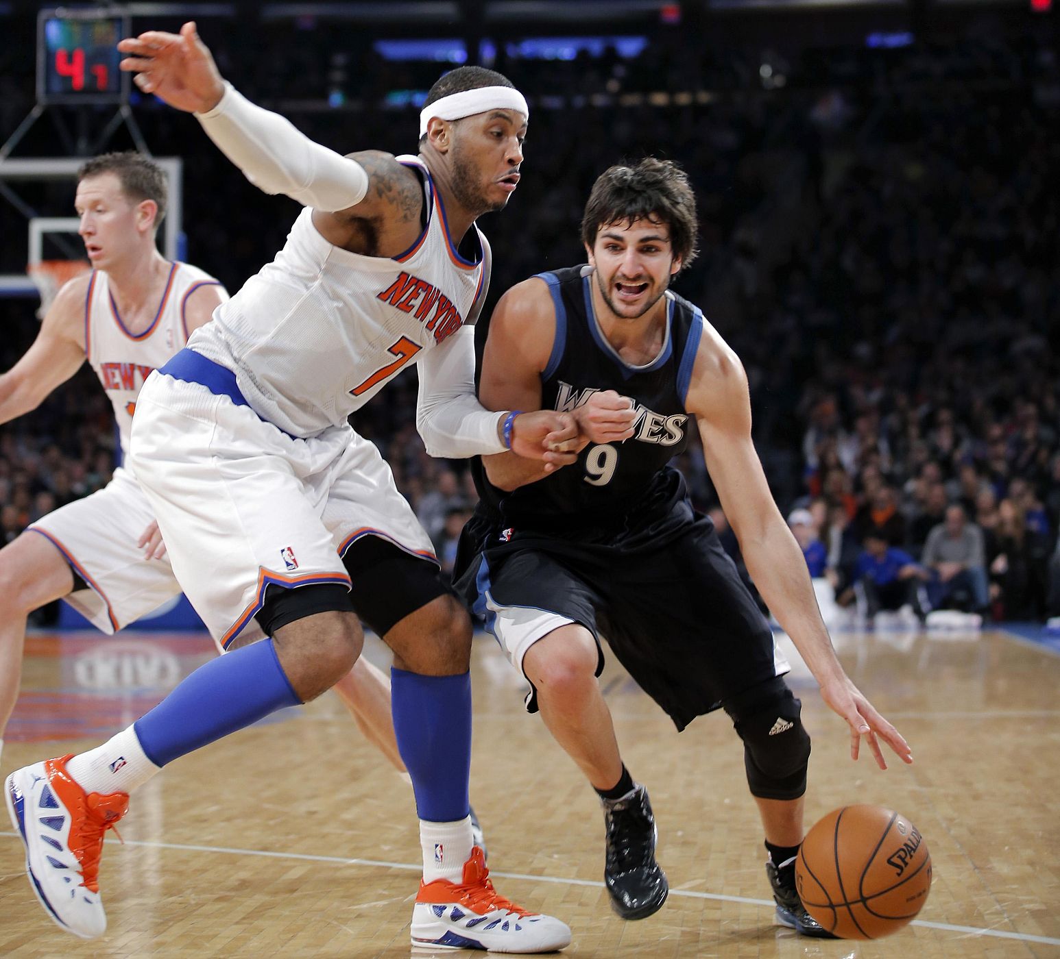 Minnesota Timberwolves Ricky Rubio tries to move ball around New York Knicks Carmelo Anthony in NBA game in New York