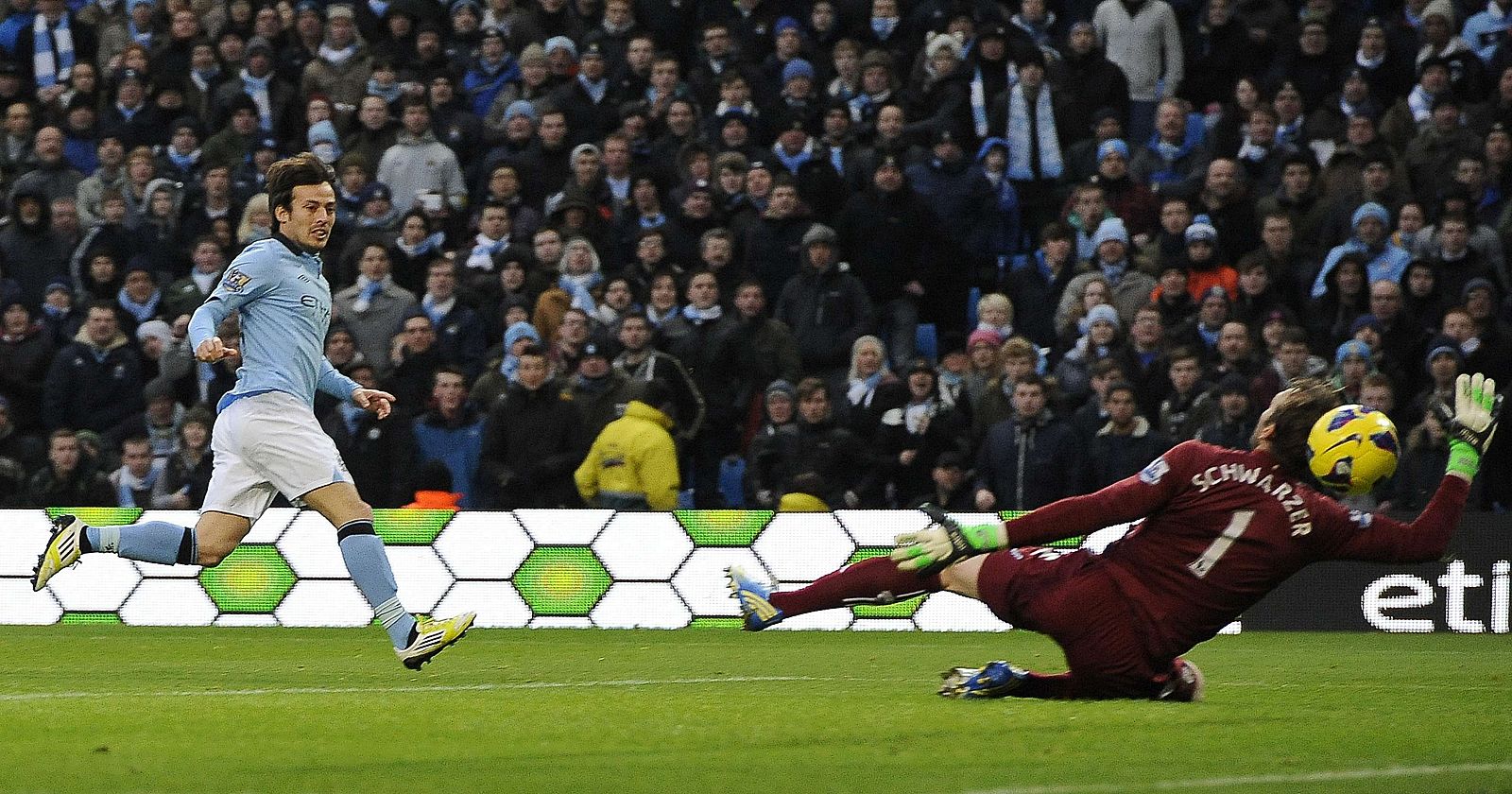 Manchester City's Silva shoots to score against Fulham during their English Premier League soccer match in Manchester