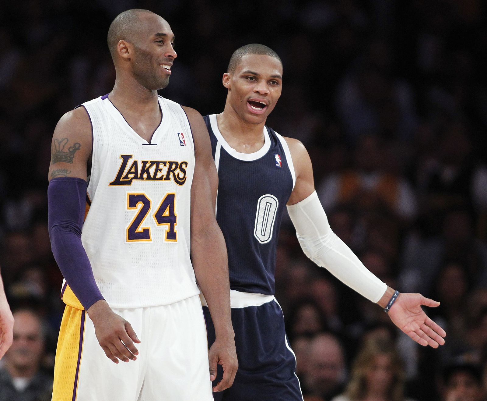 Oklahoma City Thunder Westbrook talks with Los Angeles Lakers Bryant, after a technical foul is called on Westbrook, during the second half of their NBA basketball game in Los Angeles, California
