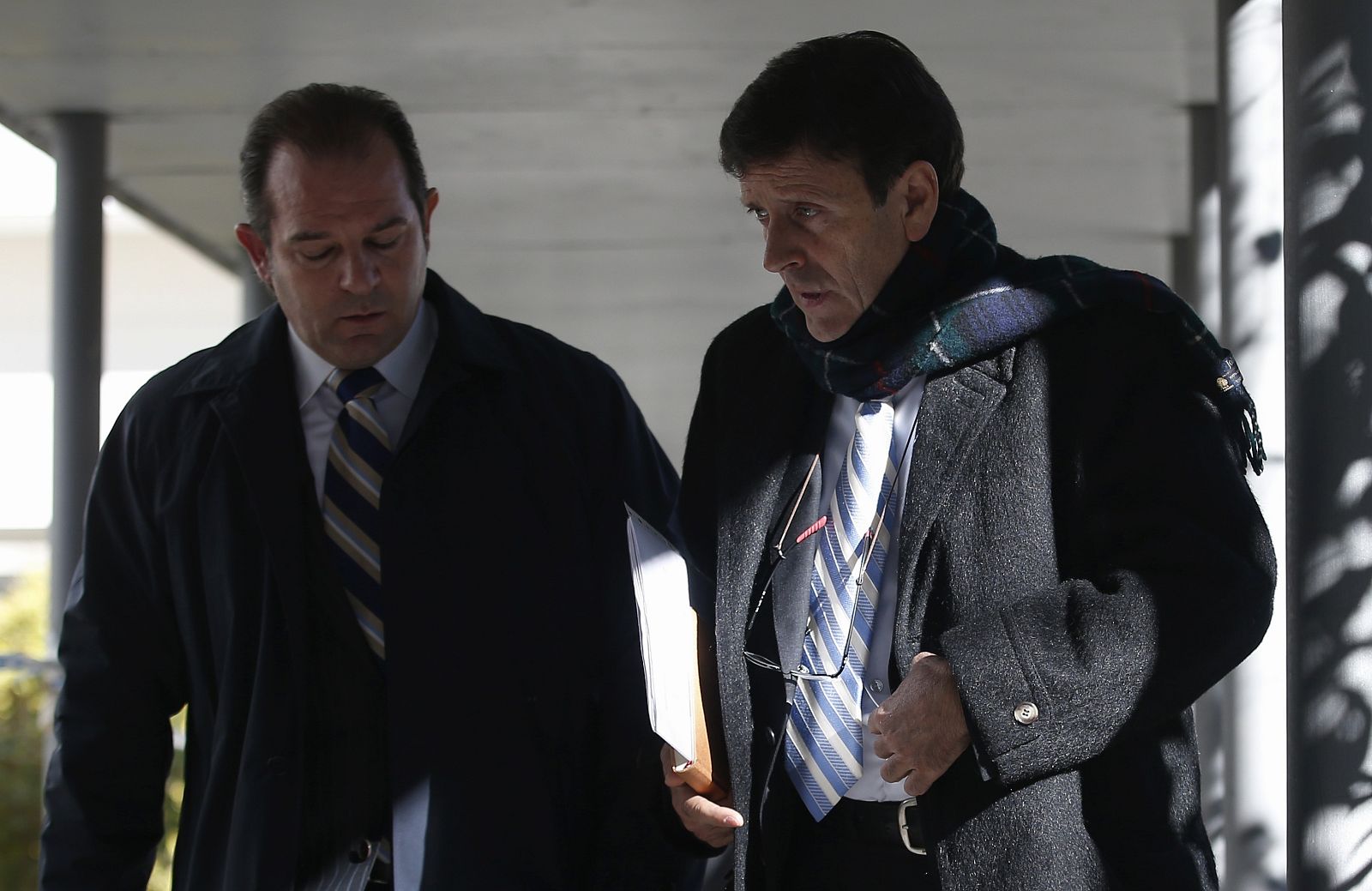 Spanish doctor Fuentes leaves a courthouse on the first day of the high-profile Operacion Puerto doping trial in Madrid