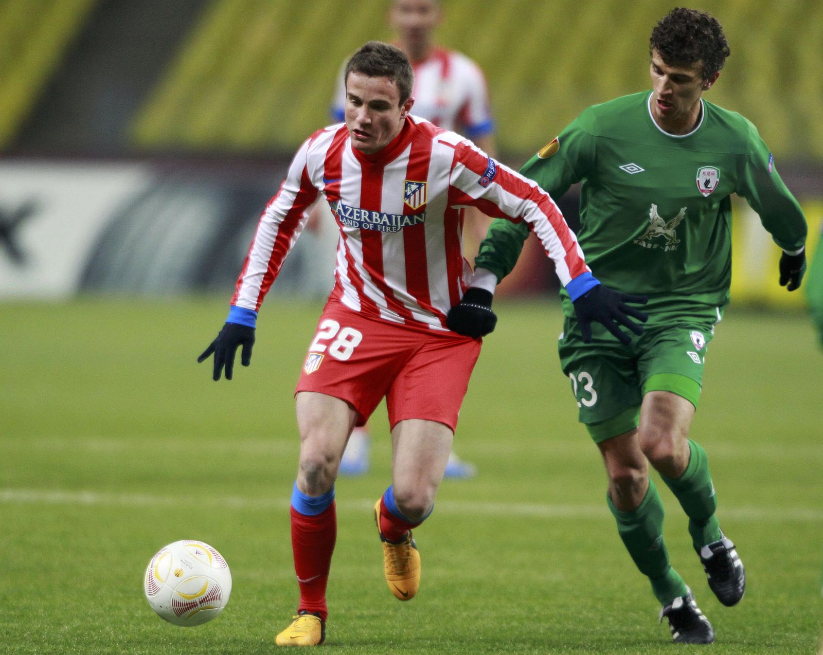Rubin Kazan's Roman Eremenko fights for the ball with Atletico Madrid's Saul Niguez during their Europa League soccer match at the Luzhniki stadium in Moscow
