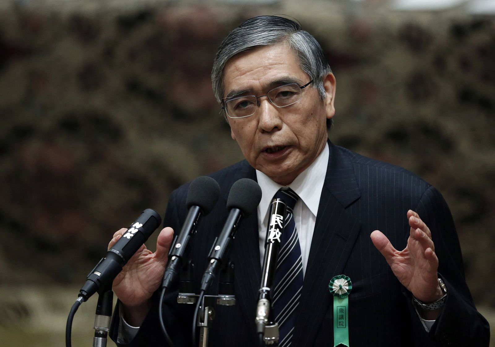 The Japan government's nominee for BOJ governor Kuroda delivers a speech at a hearings session at the lower house of the parliament in Tokyo