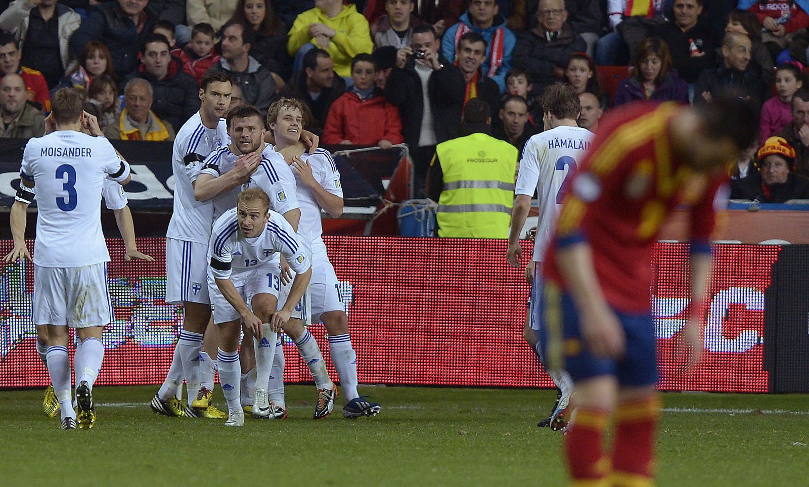 Finland players celebrate a goal against Spain during their 2014 World Cup qualifying soccer match in Gijon
