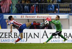 Atlético y Valencia firman tablas bajo la lluvia