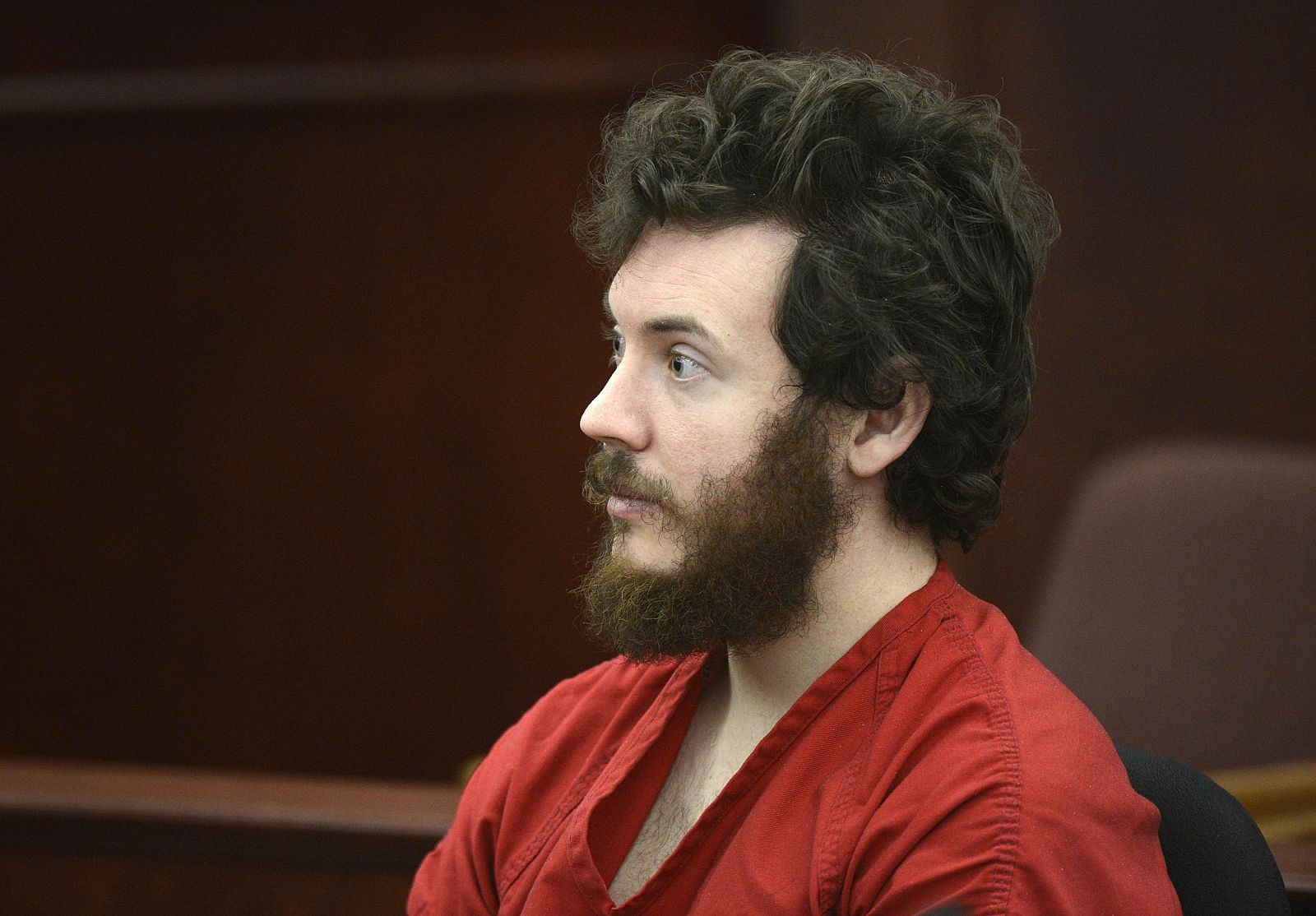 Accused Aurora theater shooting suspect James Holmes listens at his arraignment in Centennial
