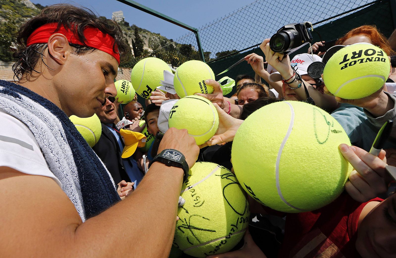 Nadal of Spain signs autographs following a training session during the first round of the Monte Carlo Masters in Monaco