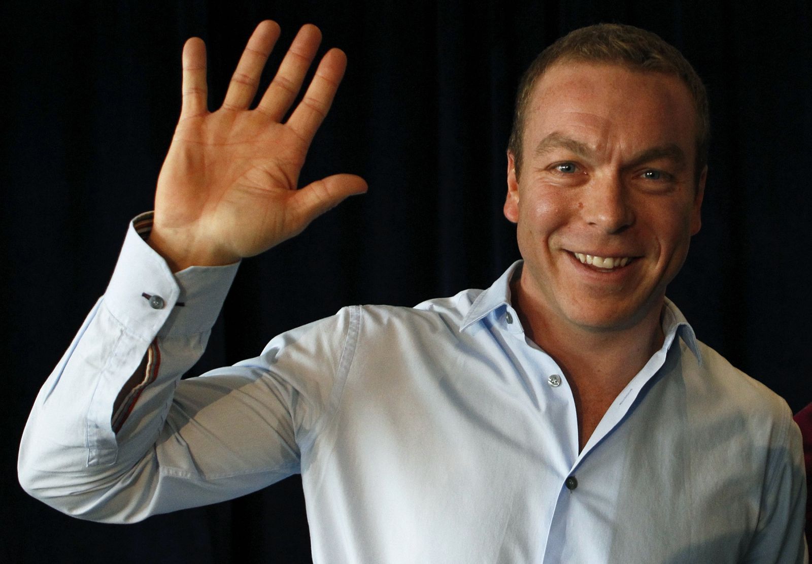 Olympic cyclist Chris Hoy waves after a news conference at which he announced his retirement from the sport, at Murrayfield stadium in Edinburgh