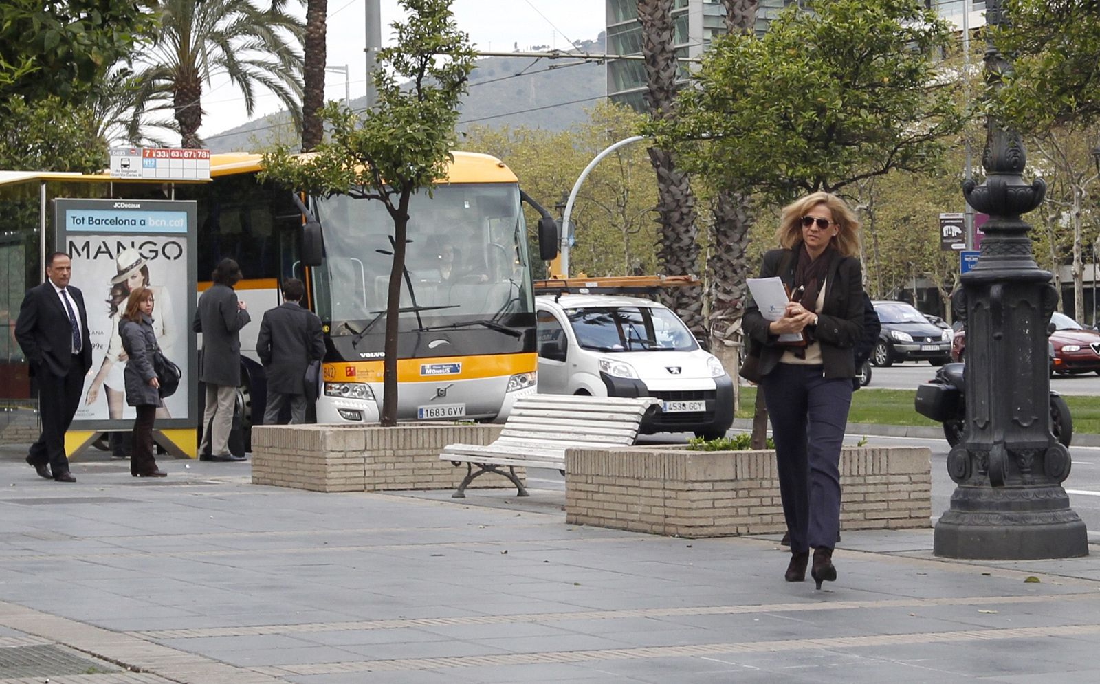 Spain's Infanta Cristina makes her way to work at the bank La Caixa in central Barcelona