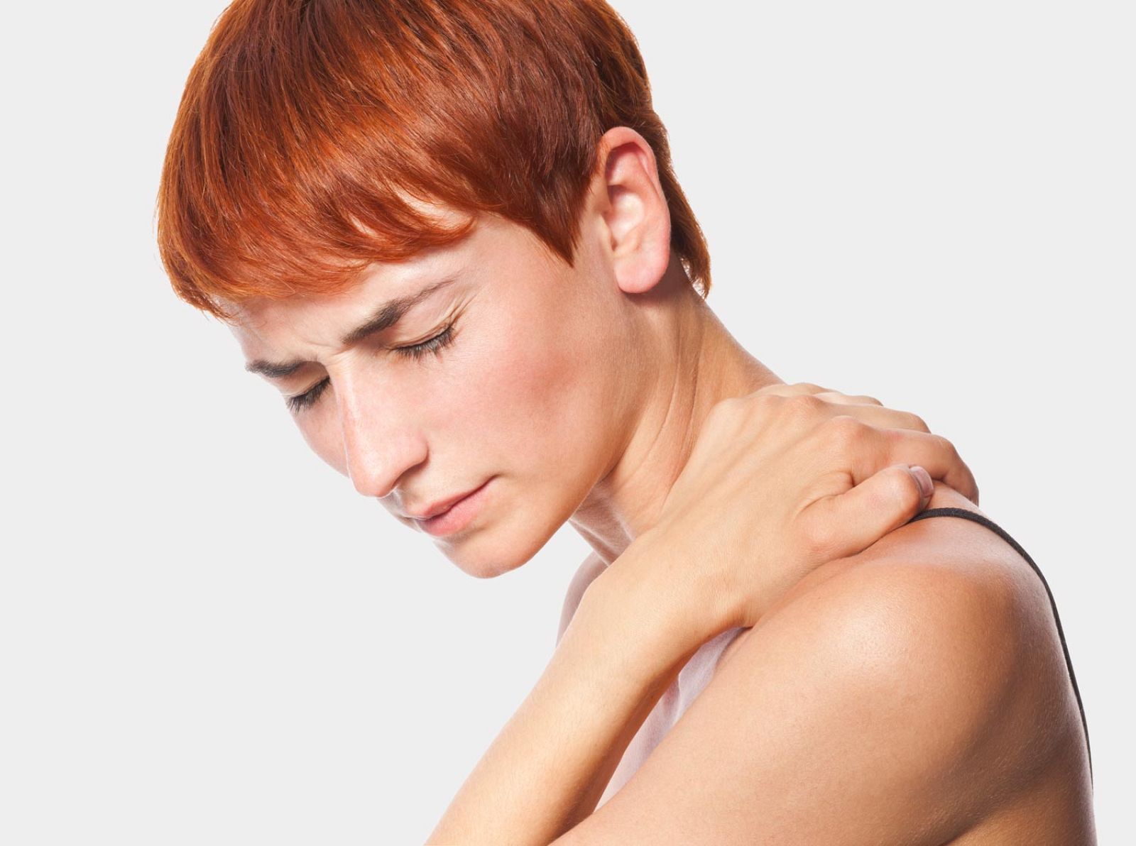 Mujer con dolor muscular.