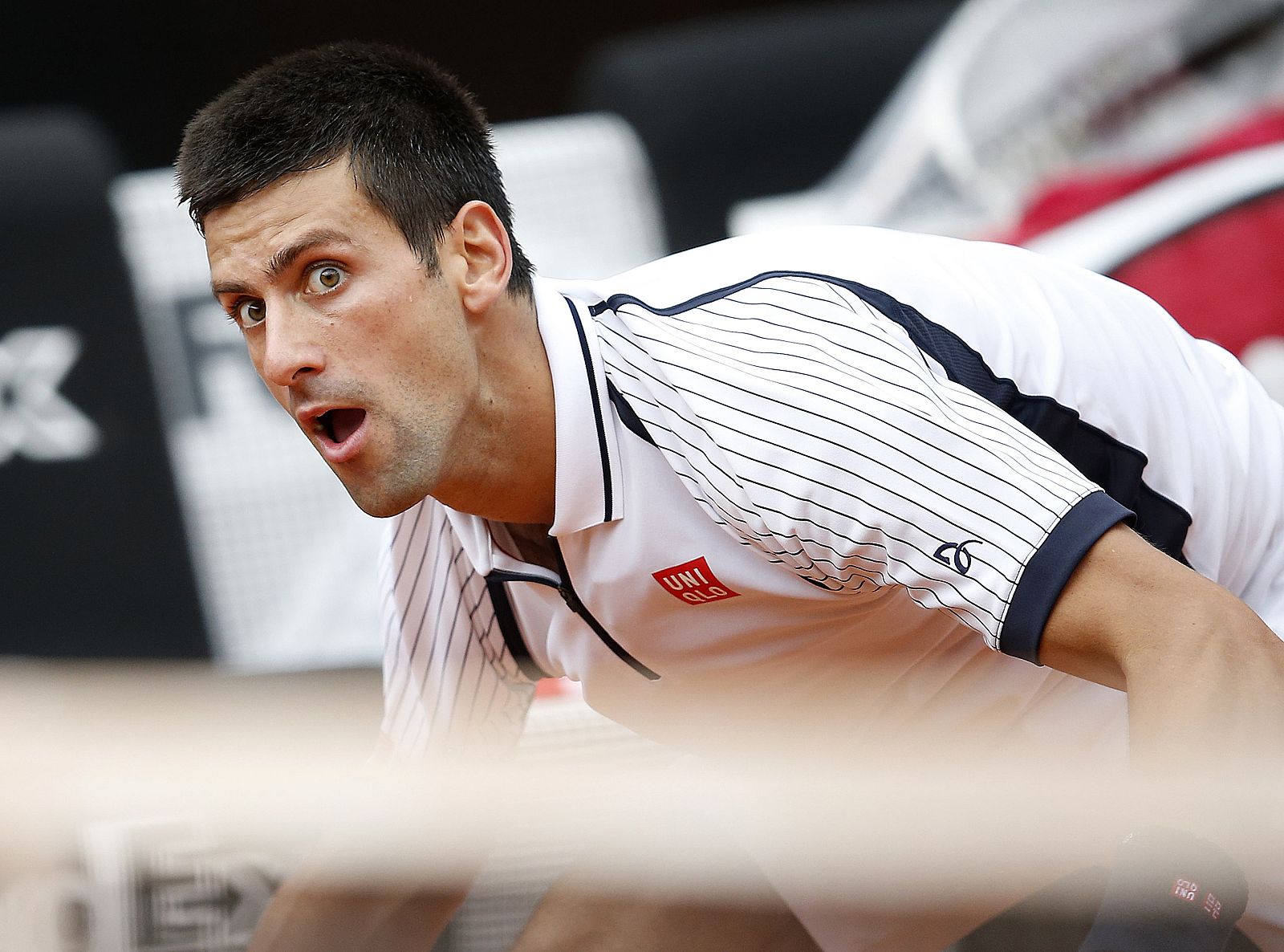 Djokovic of Serbia reacts during the men's singles match against Dolgopolov of Ukraine at the Rome Masters tennis tournament