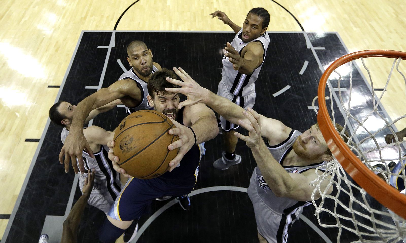 Memphis Grizzlies Gasol tries to shoot against San Antonio Spurs during the first half of Game 1 of their NBA Western Conference