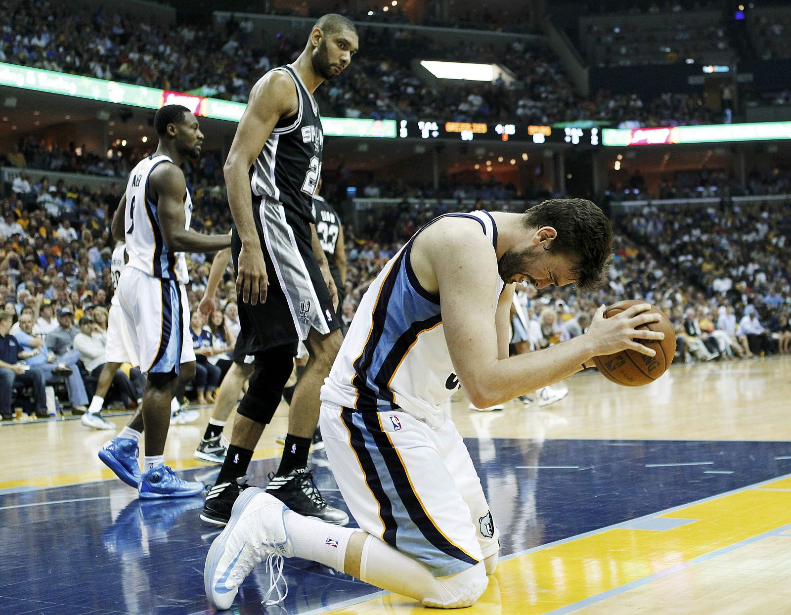 Grizzlies' Gasol reacts after a call as Spurs' Tim Duncan looks on during the fourth quarter in Game 4 of their NBA Western Conference final playoff basketball series in Memphi
