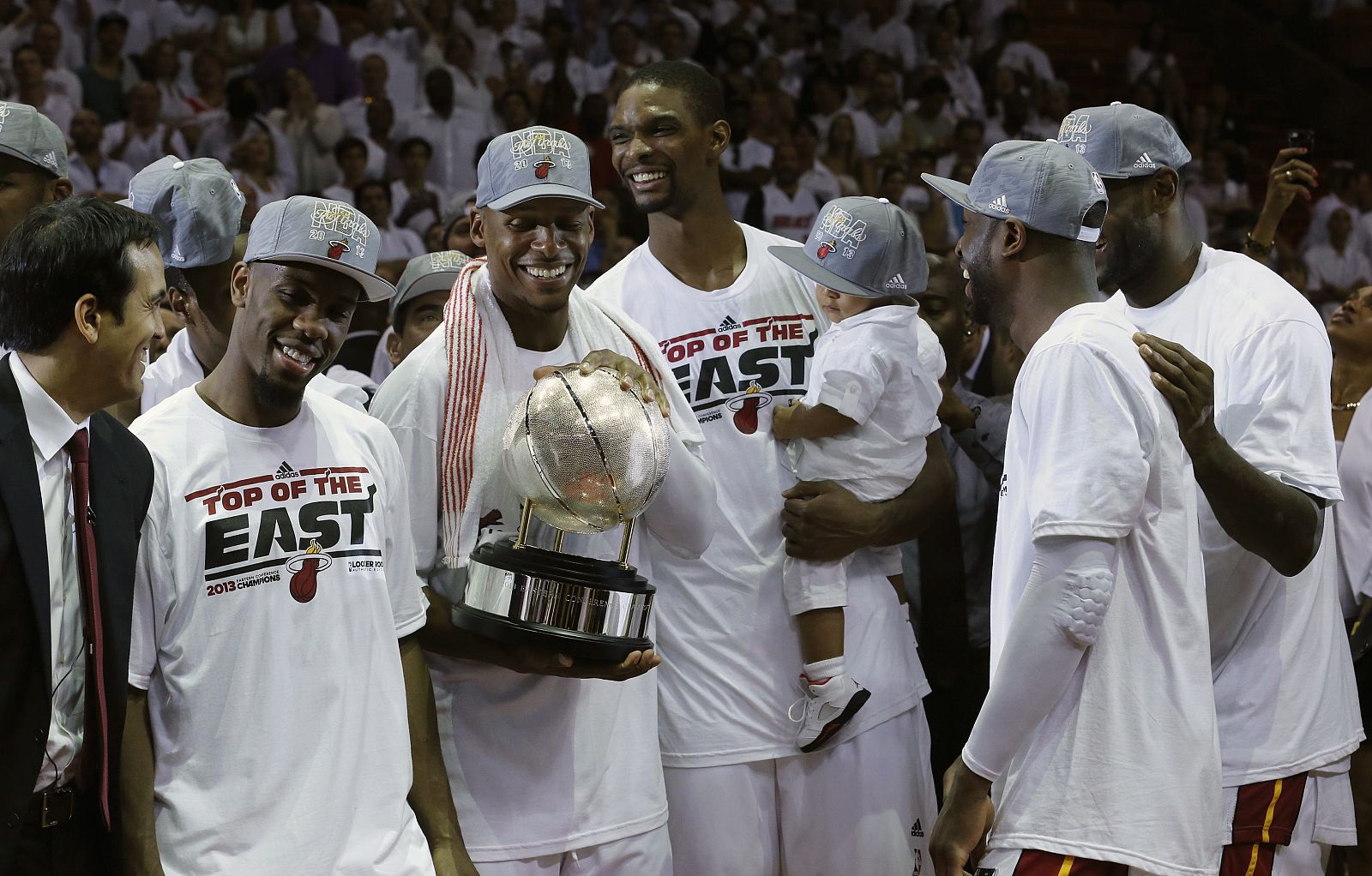 Miami Heat's James, Wade, and Bosh look on as Allen holds the Eastern Conference championship trophy after they defeated the Indiana Pacers during Game 7 of their NBA Eastern Conference final basketball playoff in Miami