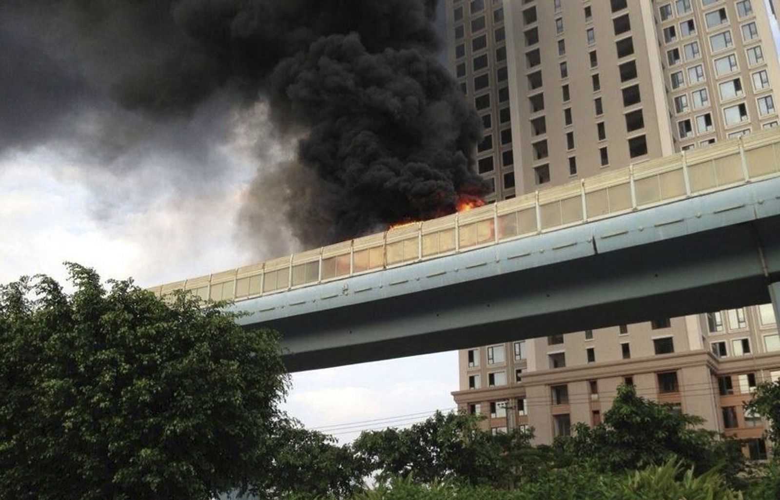 Smoke emits from a bus that is on fire in Xiamen