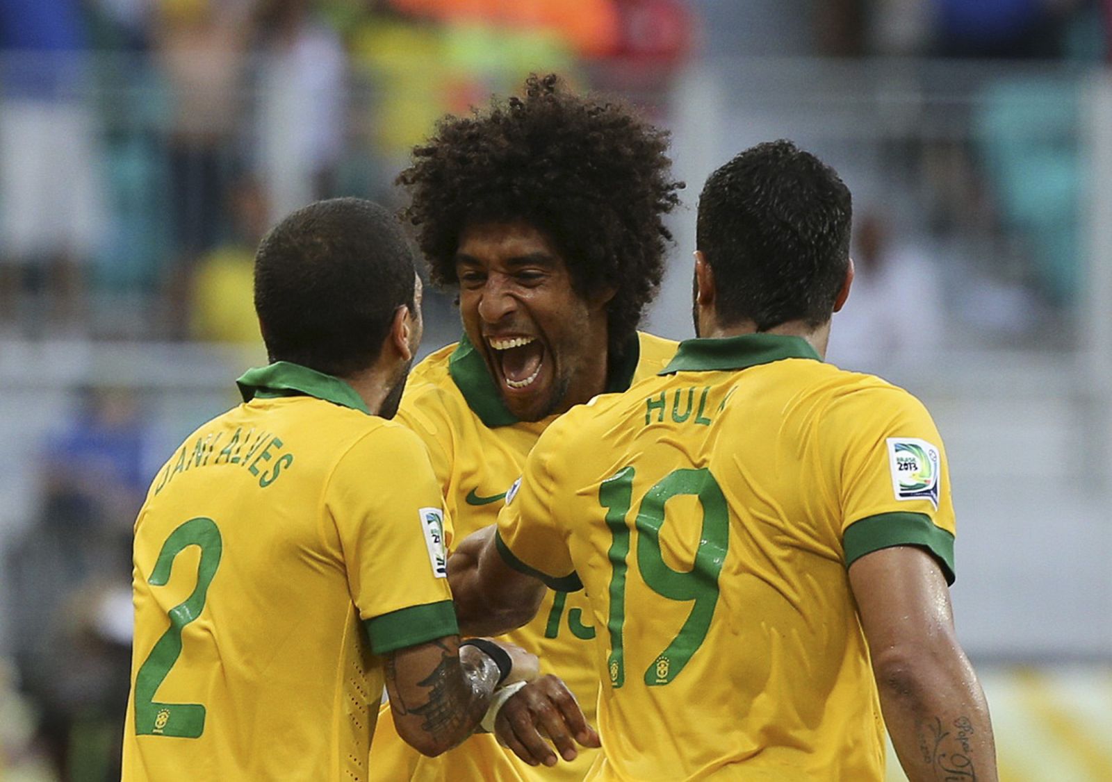 Brazil's Dante celebrates with his teammates after scoring a goal against Italy during their Confederations Cup Group A soccer match at the Arena Fonte Nova in Salvador