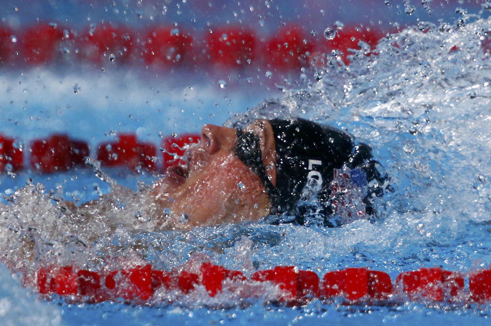 Lochte of the U.S. swims to win the men's 200m backstroke final during the World Swimming Championships at the Sant Jordi arena in Barcelona