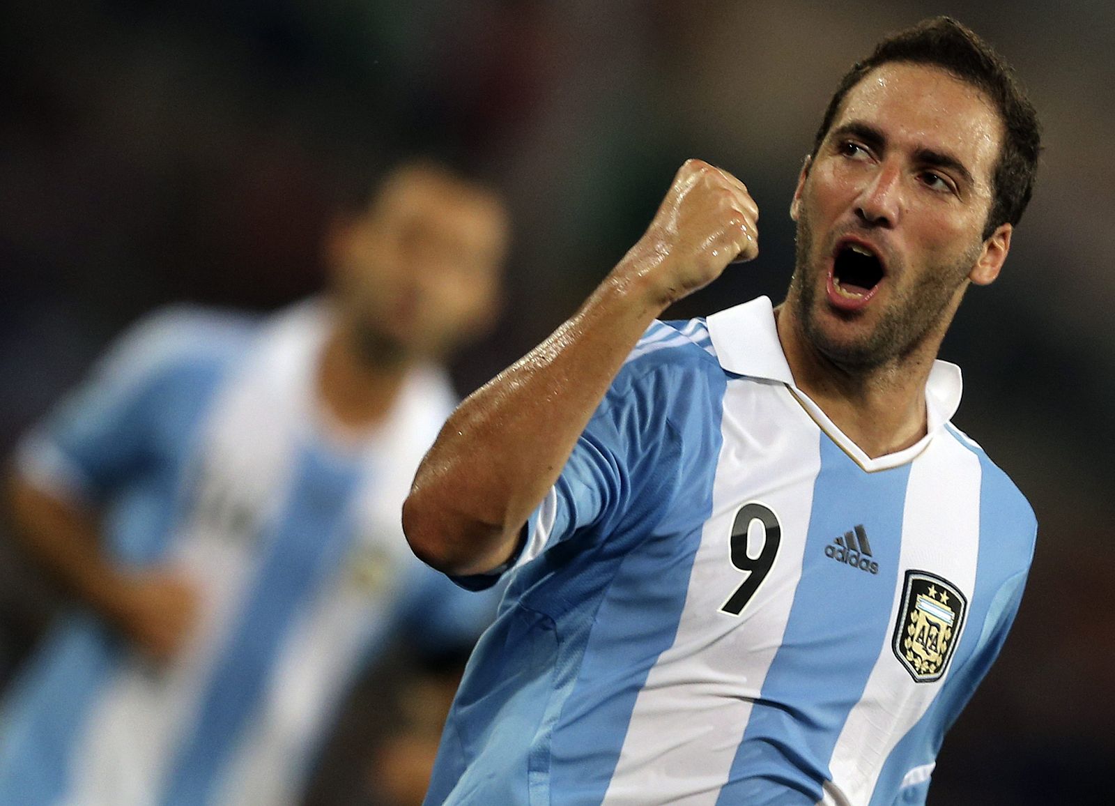 Argentina's Higuain celebrates after scoring against Italy during their international friendly soccer match at the Olympic stadium in Rome