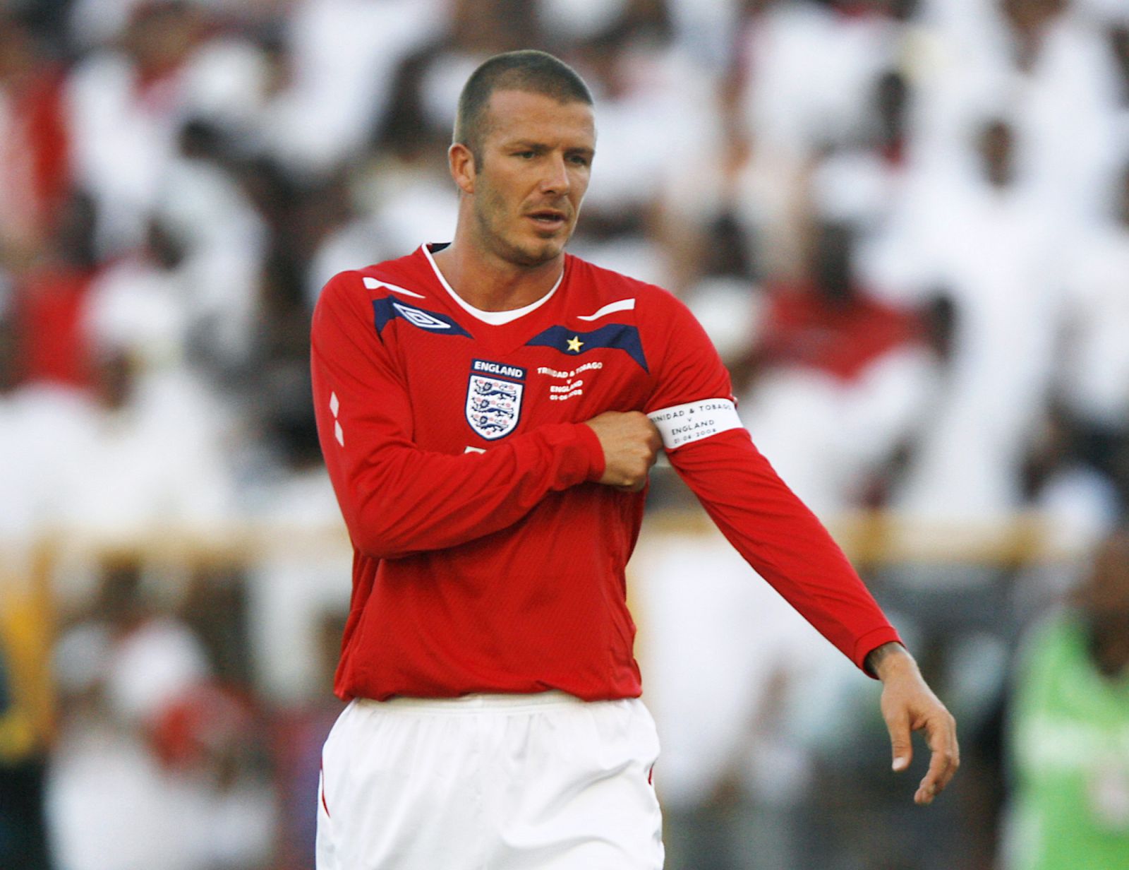 England's Beckham adjusts his captain's armband during their soccer match against Trinidad and Tobago in Port of Spain