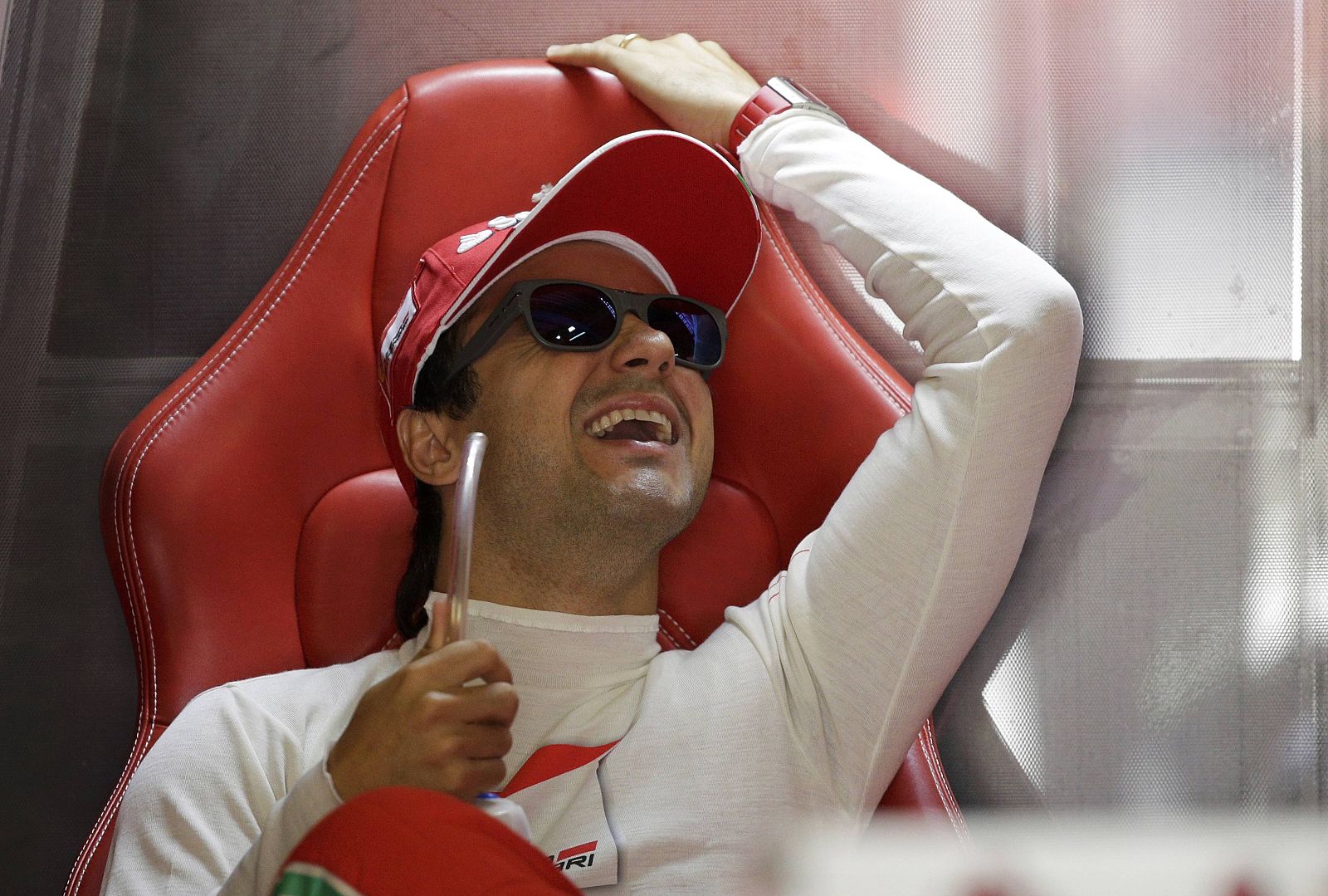 Ferrari Formula One driver Massa laughs during the third practice session of the Italian F1 Grand Prix at the Monza circuit