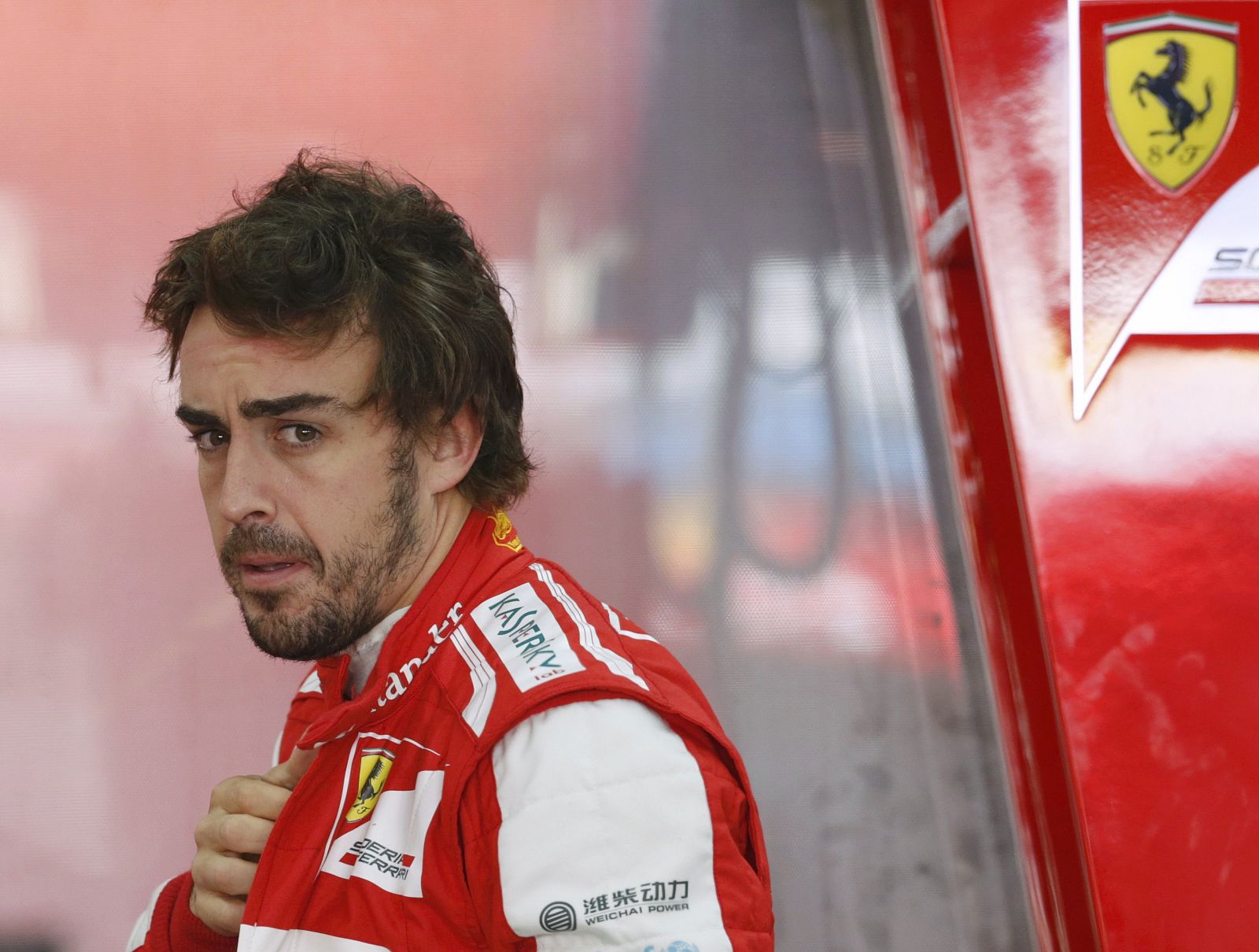 Ferrari Formula One driver Alonso looks on during the third practice session of the Korean F1 Grand Prix in Yeongam
