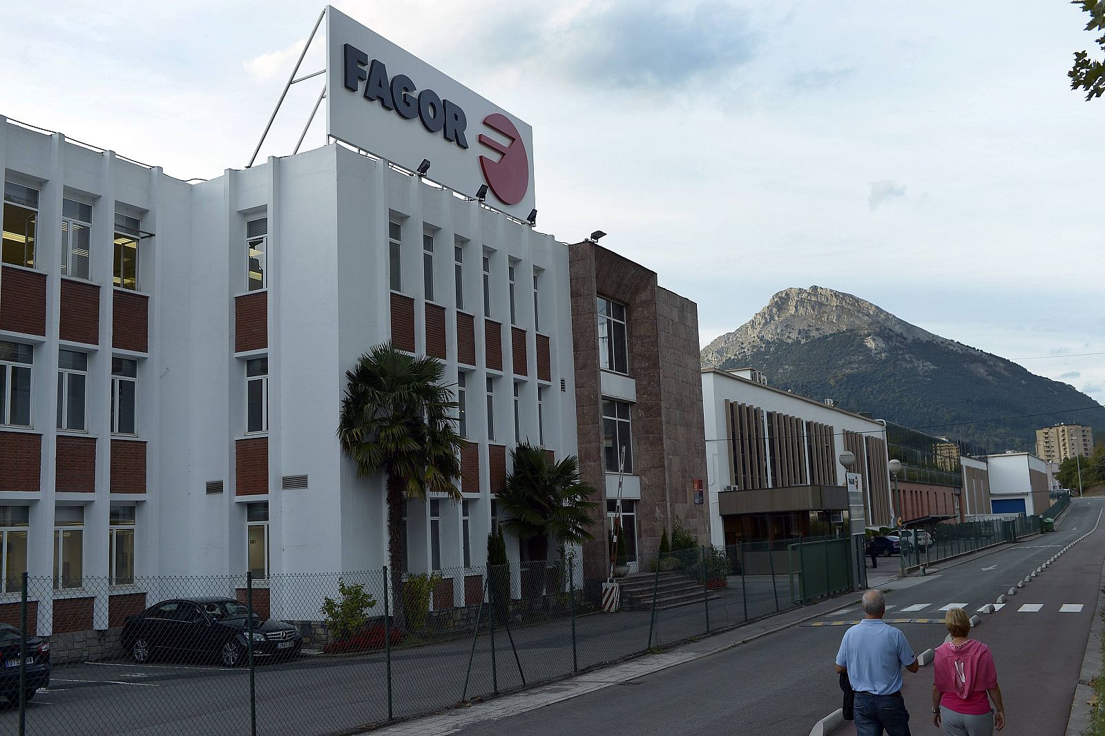 People walk past the entrance to domestic appliance makers Fagor in Mondragon