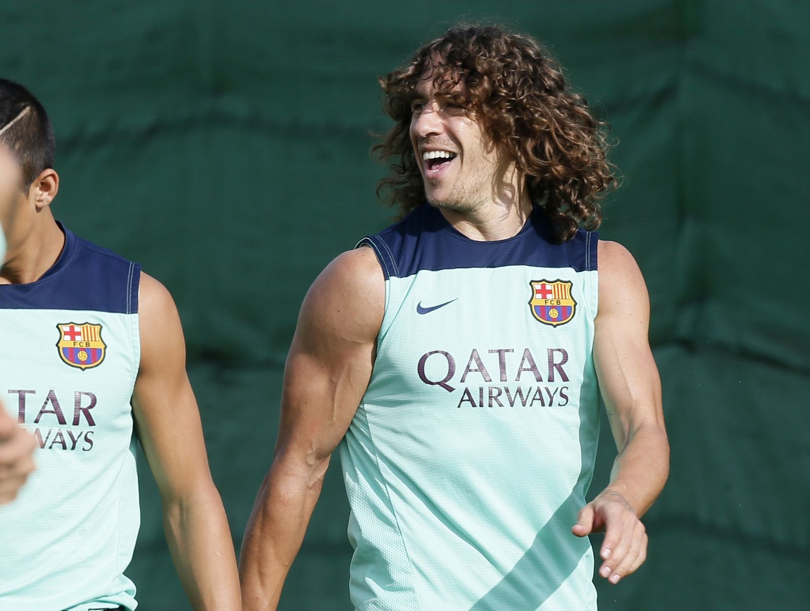 FC Barcelona's Puyol smiles to his teammates during a training session at the Sport Center FC Barcelona Joan Gamper in Sant Joan Despi near Barcelona