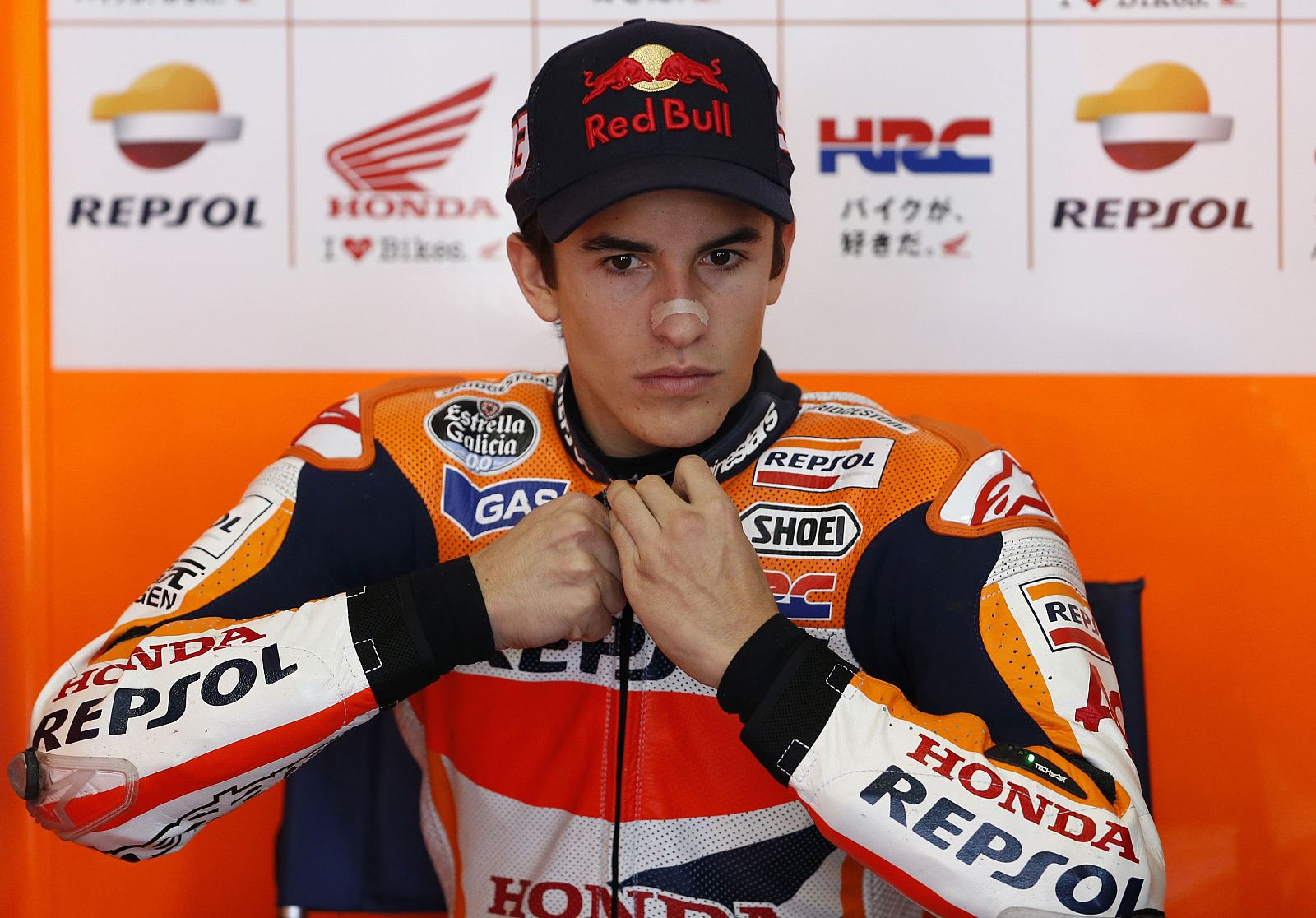 Honda MotoGP rider Marquez of Spain prepares for his practice session in his garage before the Japanese Grand Prix in Motegi