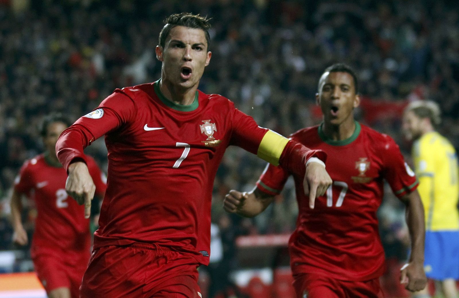 Portugal's Ronaldo celebrates beside team mate Nani after scoring a goal against Sweden during his 2014 World Cup first leg qualifying playoff soccer match in Lisbon