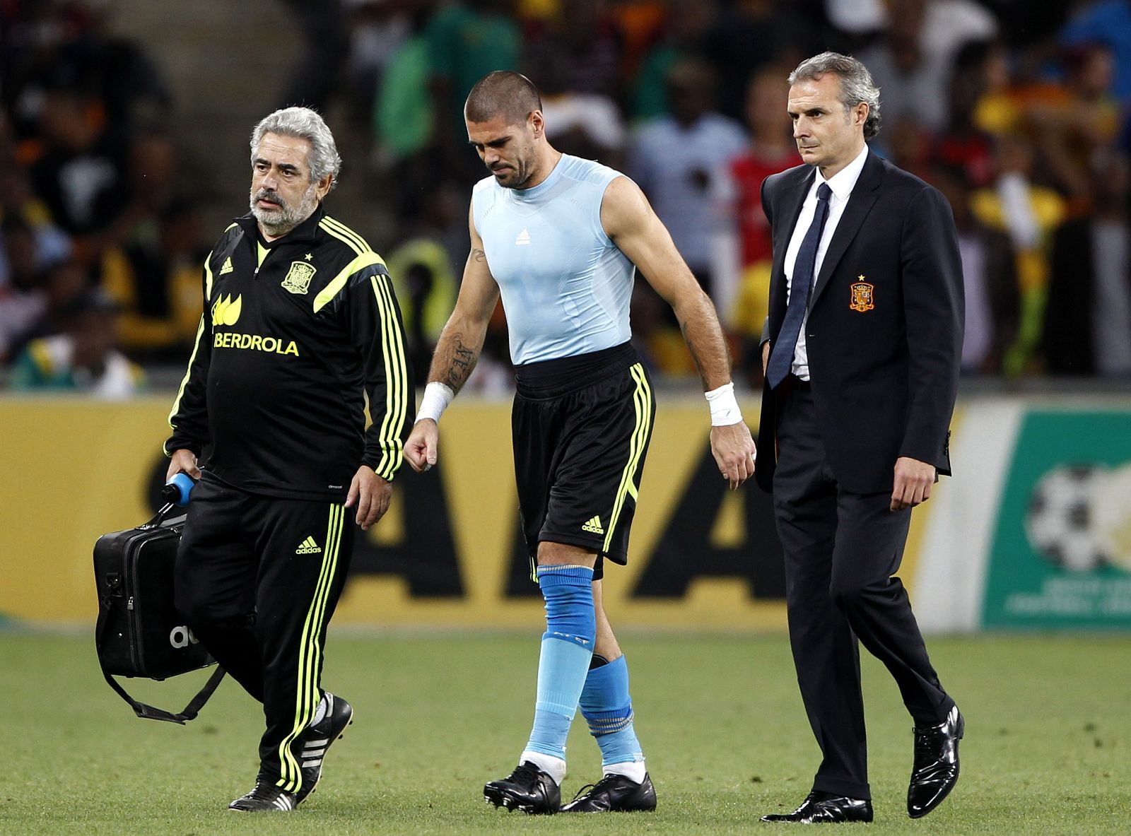 Spain's goalkeeper Valdes is escorted off the field during their international friendly soccer match against South Africa in Johannesburg