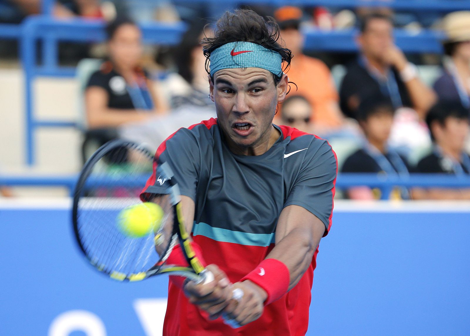 Rafael Nadal hits a return to David Ferrer during semi-final tennis match at the Mubadala World Tennis Championship in Abu Dhabi