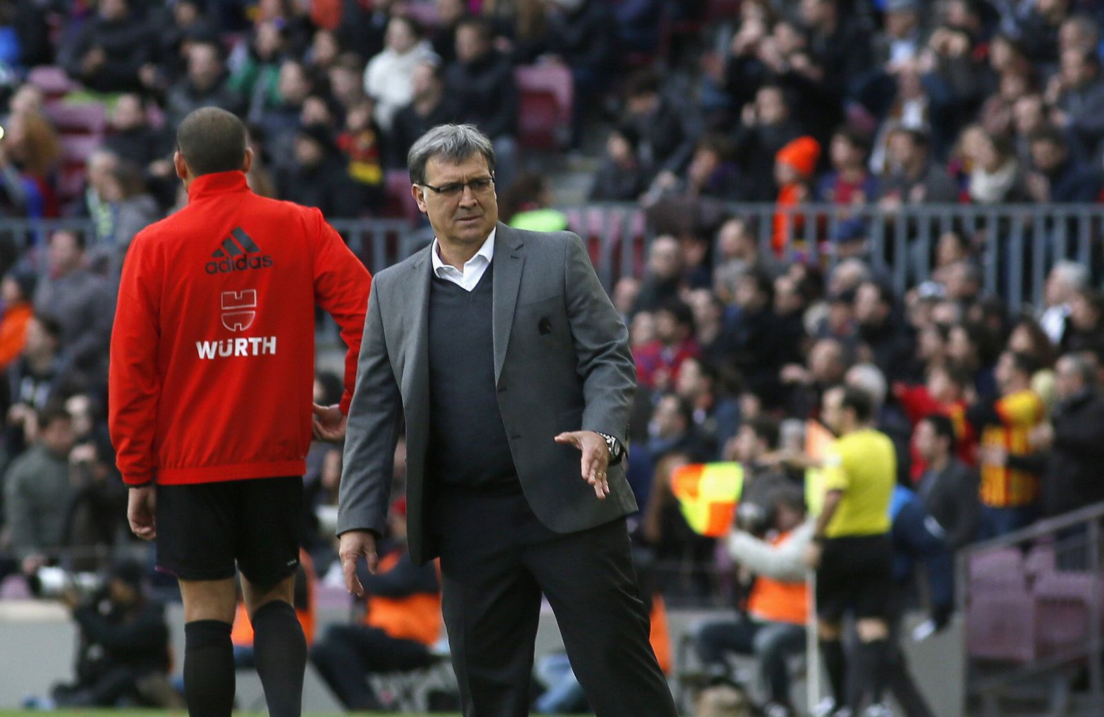 Barcelona's coach 'Tata' Martino gestures to his players during the Spanish first division soccer match against Elche at Camp Nou stadium, in Barcelona