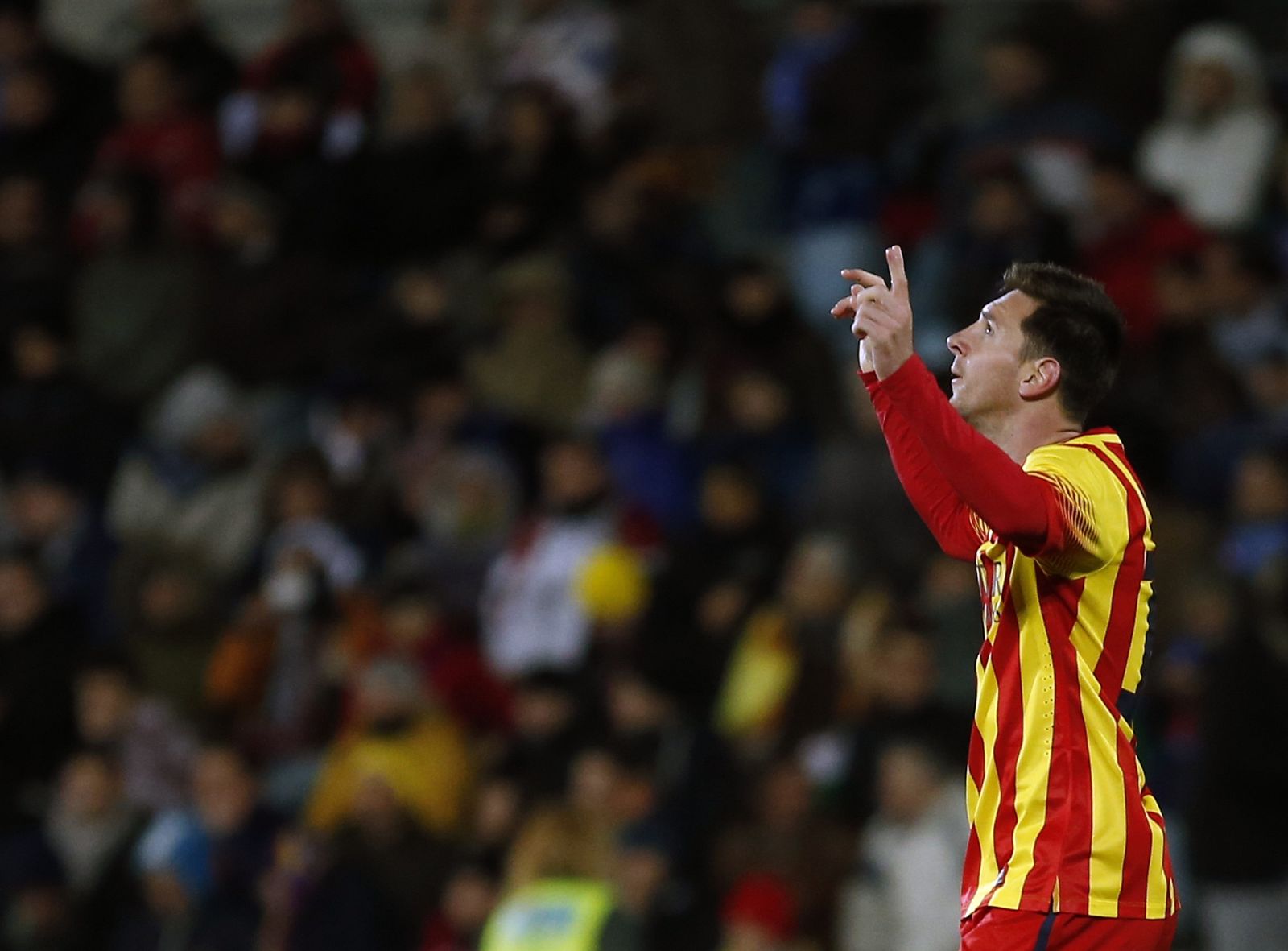 Barcelona's Messi celebrates after scoring a goal against Getafe during their Spanish King's Cup soccer match in Getafe