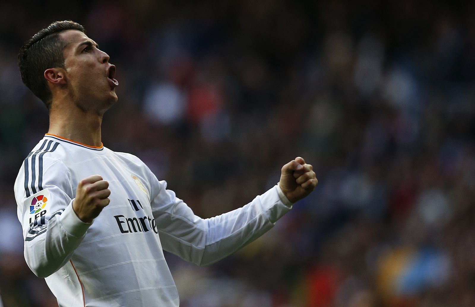 Real Madrid's Cristiano Ronaldo celebrates his goal during their Spanish first division soccer match against Granada at the Santiago Bernabeu stadium in Madrid