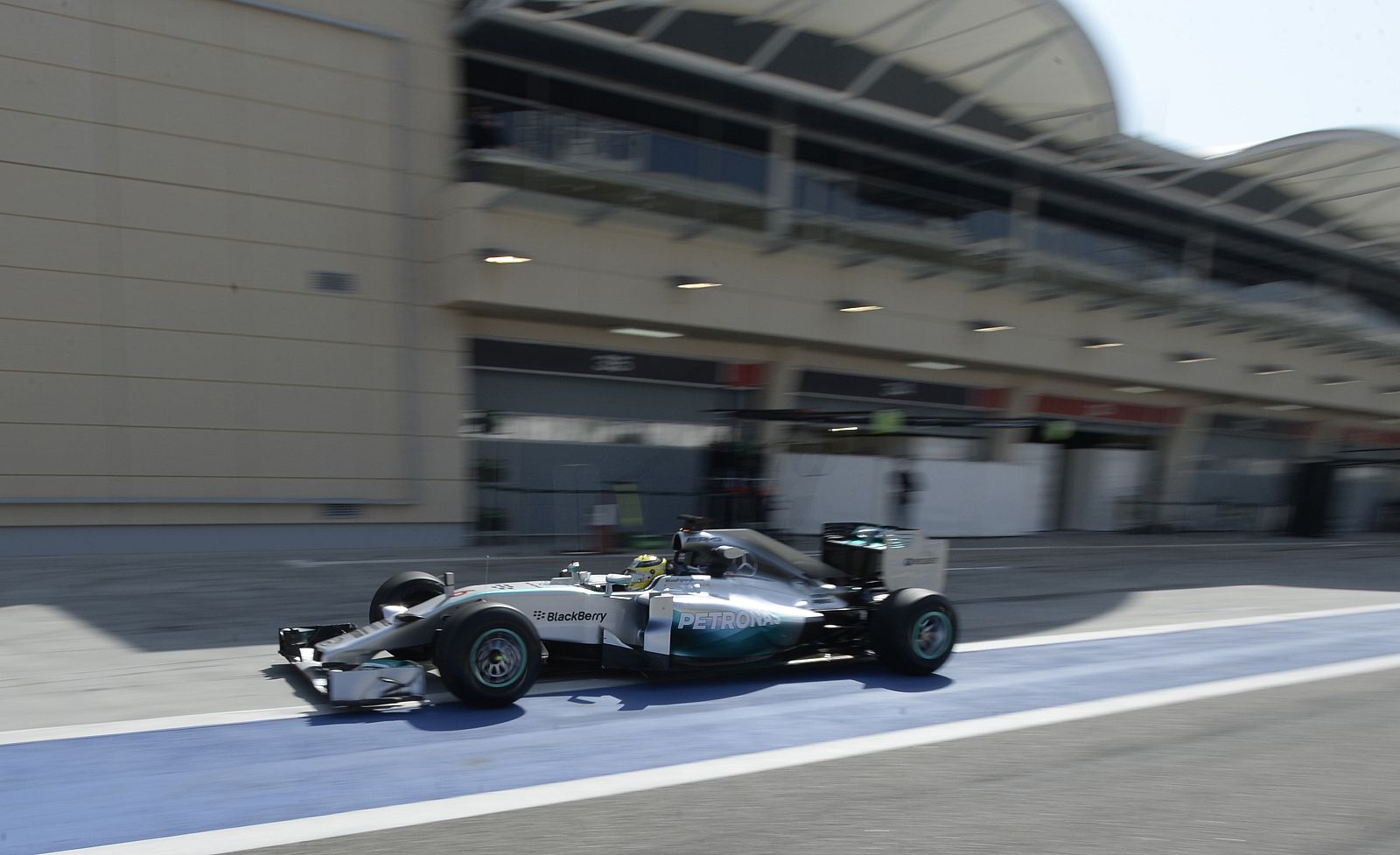Mercedes F1 driver Nico Rosberg of Germany leaves the pit lane during the second day of Formula One testing at the Bahrain International Circuit in Sakhir